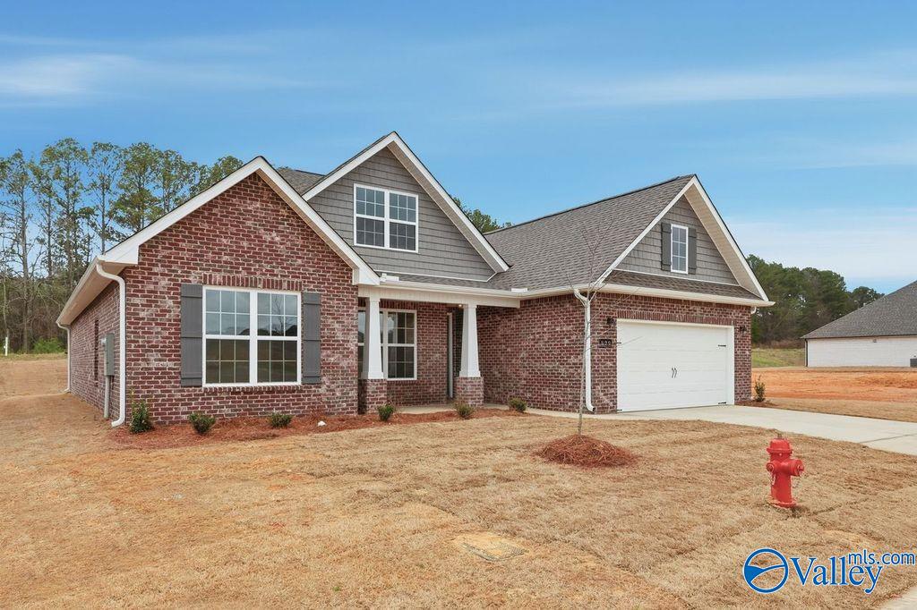 Brick single-story home with 2-car garage and front porch in Cain Park, Hartselle, Alabama - Davidson Homes The Rockford B