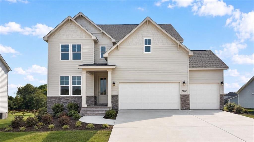 Two-story Hickory A floor plan by Davidson Homes with 3-car garage in Wehunt Meadows, Hoschton, Georgia.