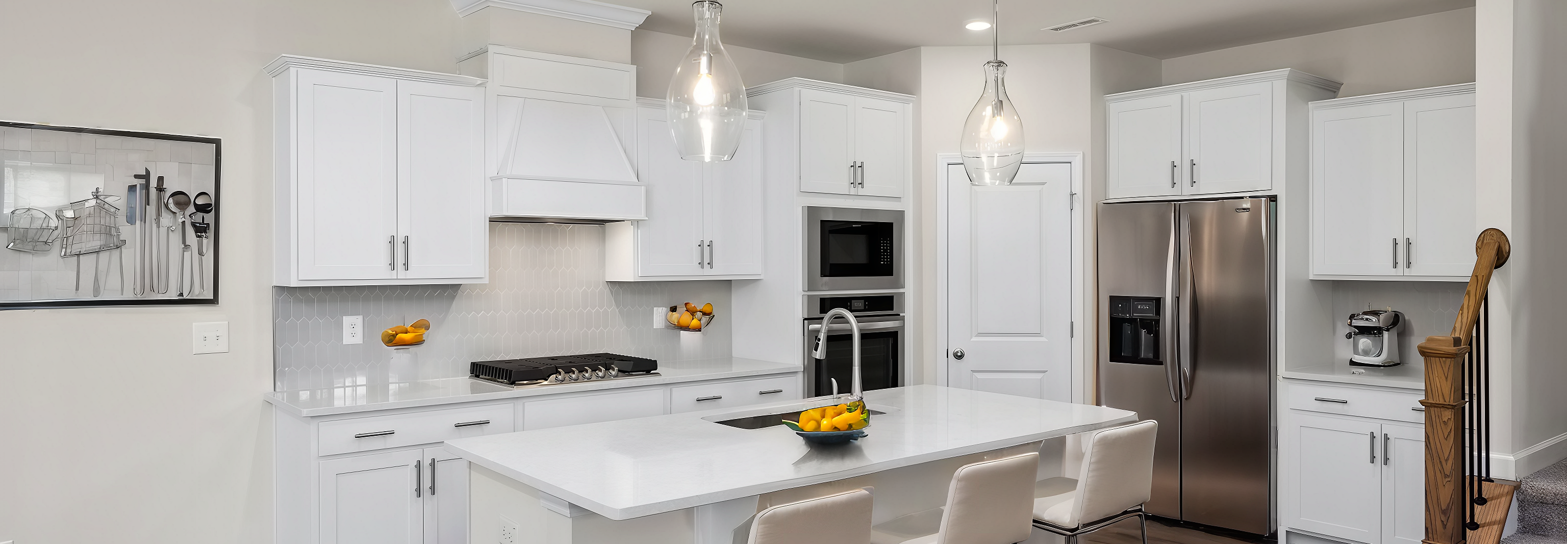 Spacious white kitchen with quartz island, bar stools, stainless appliances at Wendell Ridge, Wendell NC by Davidson Homes