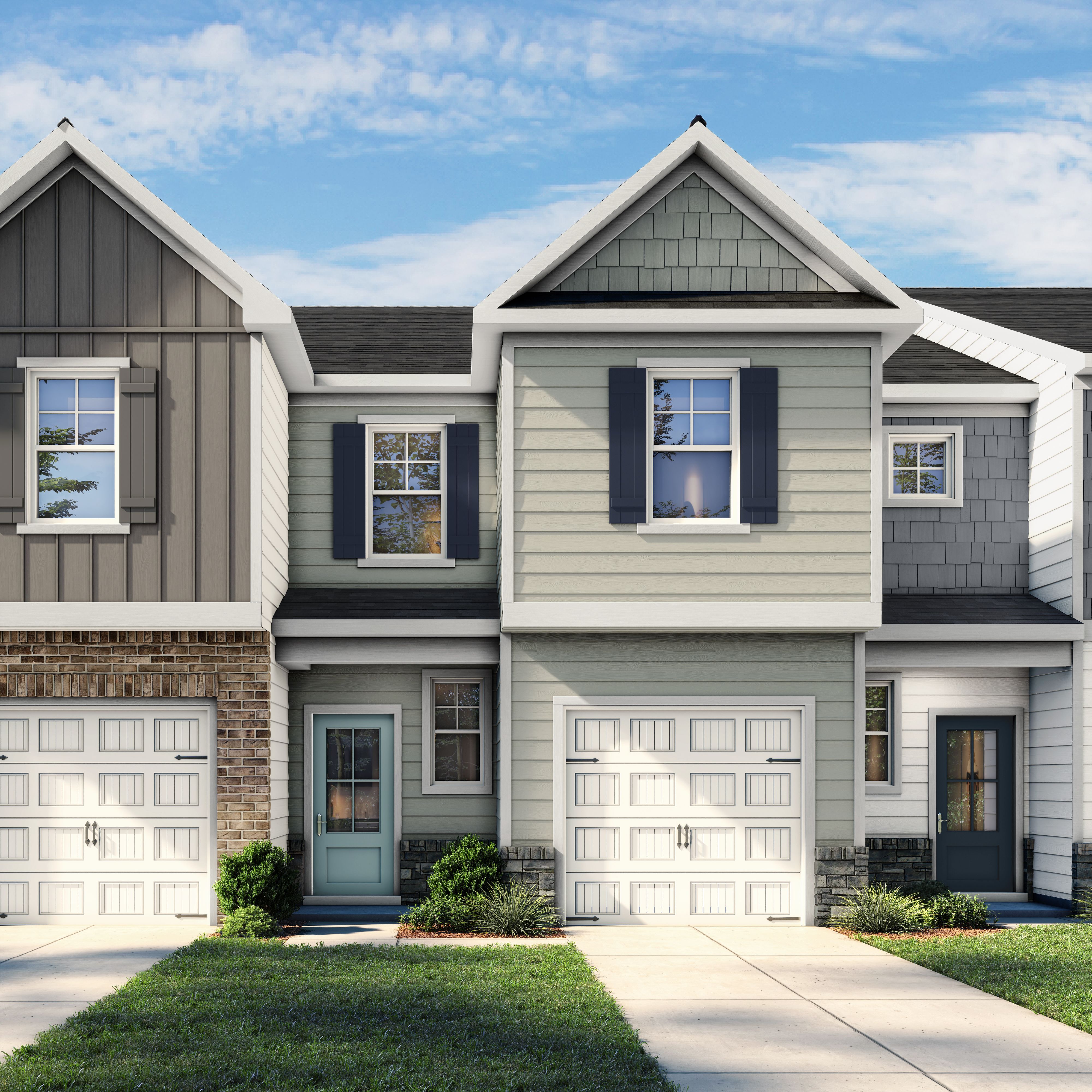Two-story Wilmington II B multi-family home exterior featuring a 1-car garage, stone accents, and blue-grey siding.