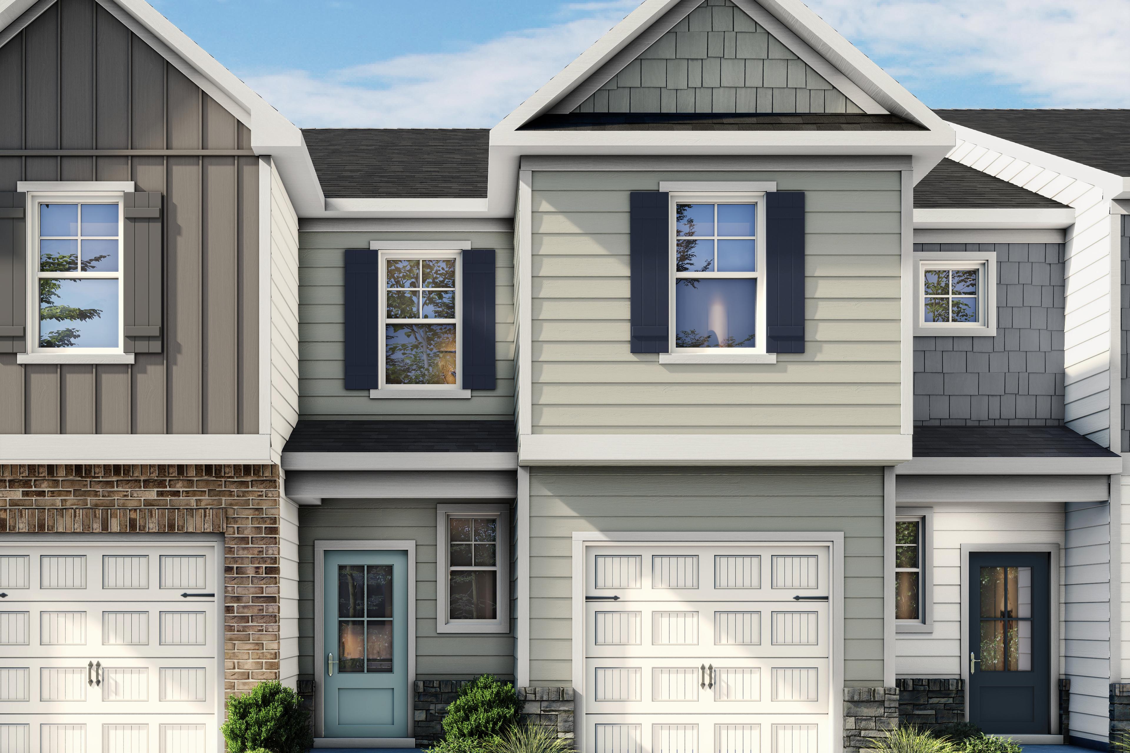 Two-story Wilmington II B multi-family home exterior featuring a 1-car garage, stone accents, and blue-grey siding.