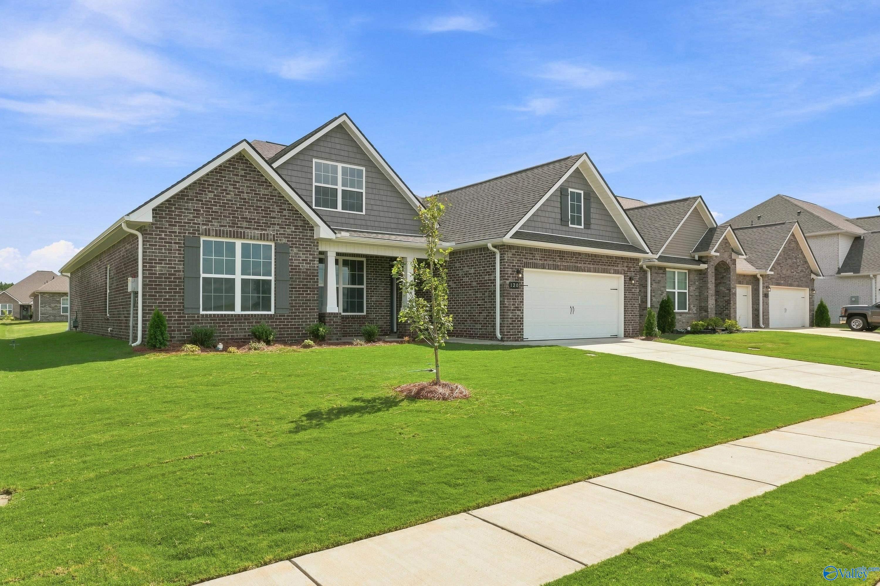 The Rockford B floor plan by Davidson Homes in Kendall Downs, Toney, Alabama featuring a 1.5-story brick exterior.