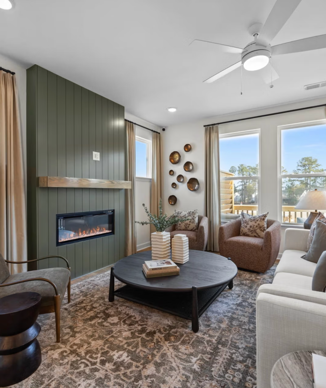 Modern white kitchen in Camden Park, Knightdale NC with shaker cabinets, large island bar, stainless steel appliances, hardwood floors