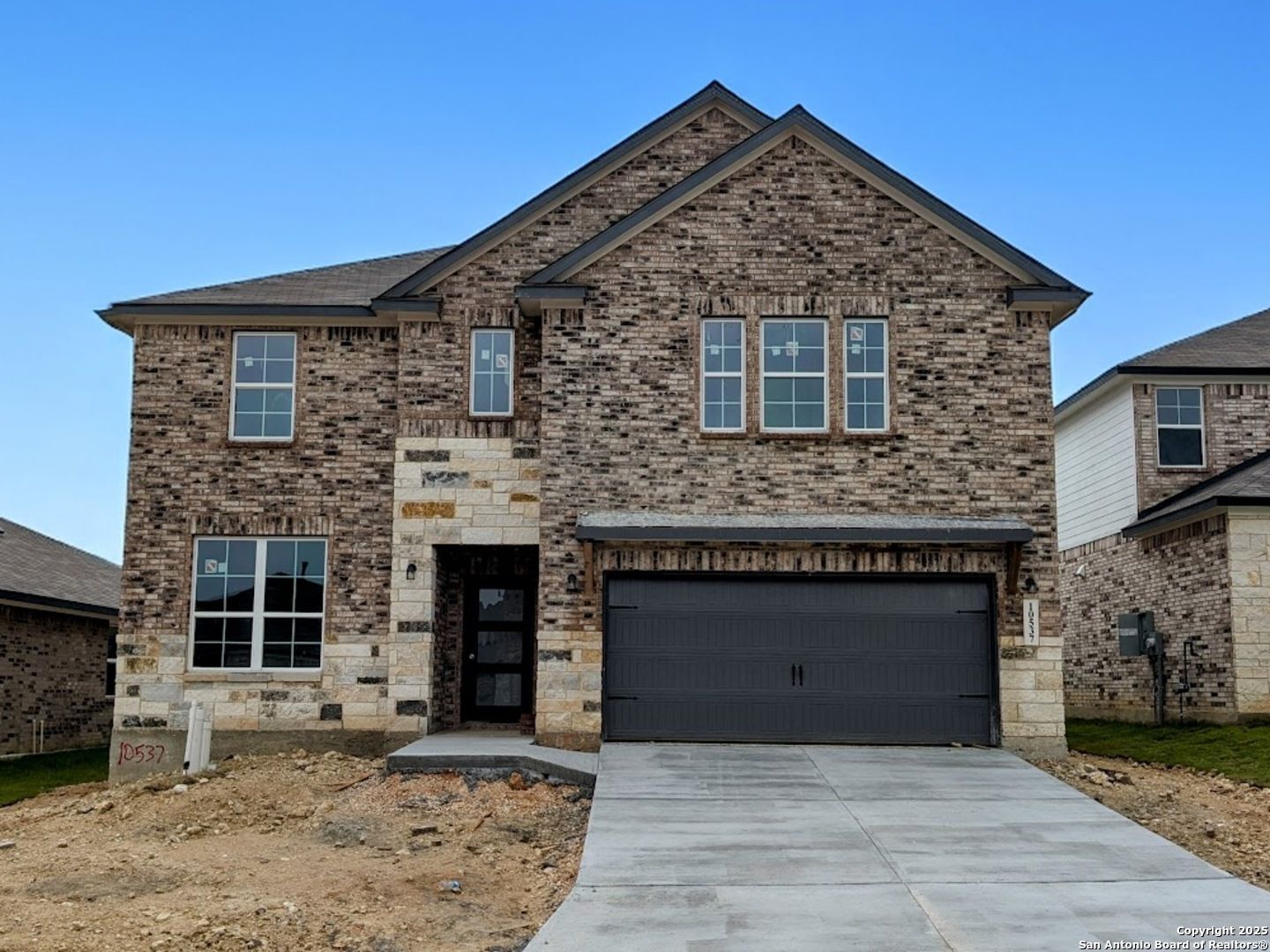 Stylish 2-story brick home with stone accents and 2-car garage in Bricewood, San Antonio, Texas - Davidson Homes Sequoia B