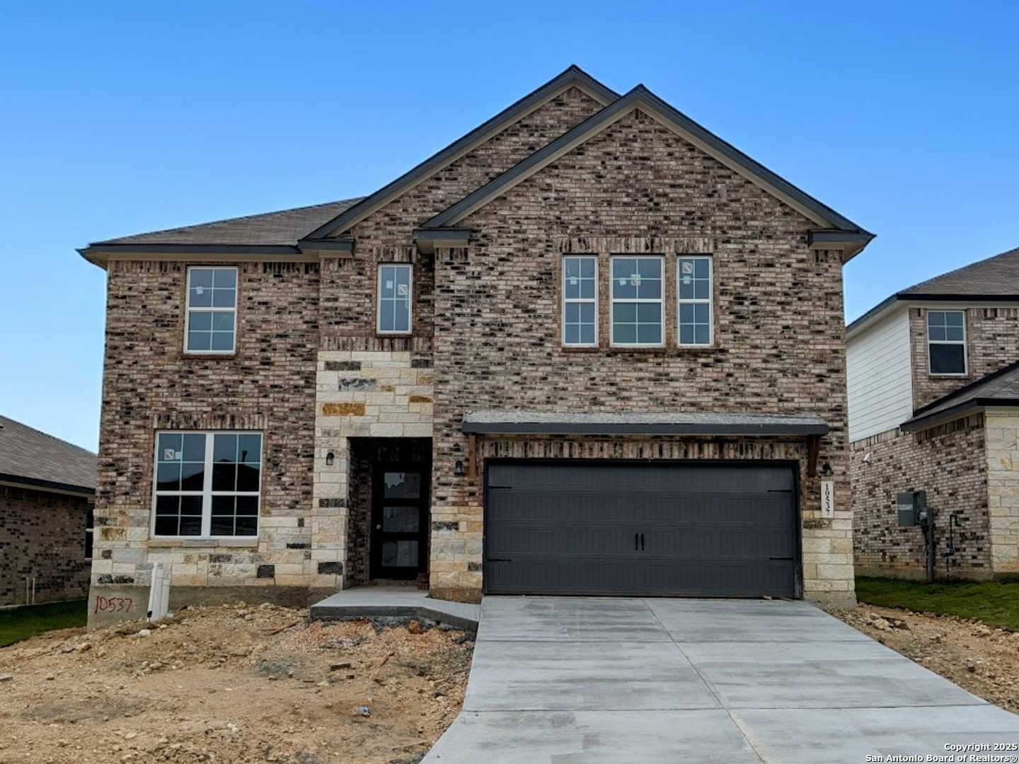 Stylish 2-story brick home with stone accents and 2-car garage in Bricewood, San Antonio, Texas - Davidson Homes Sequoia B