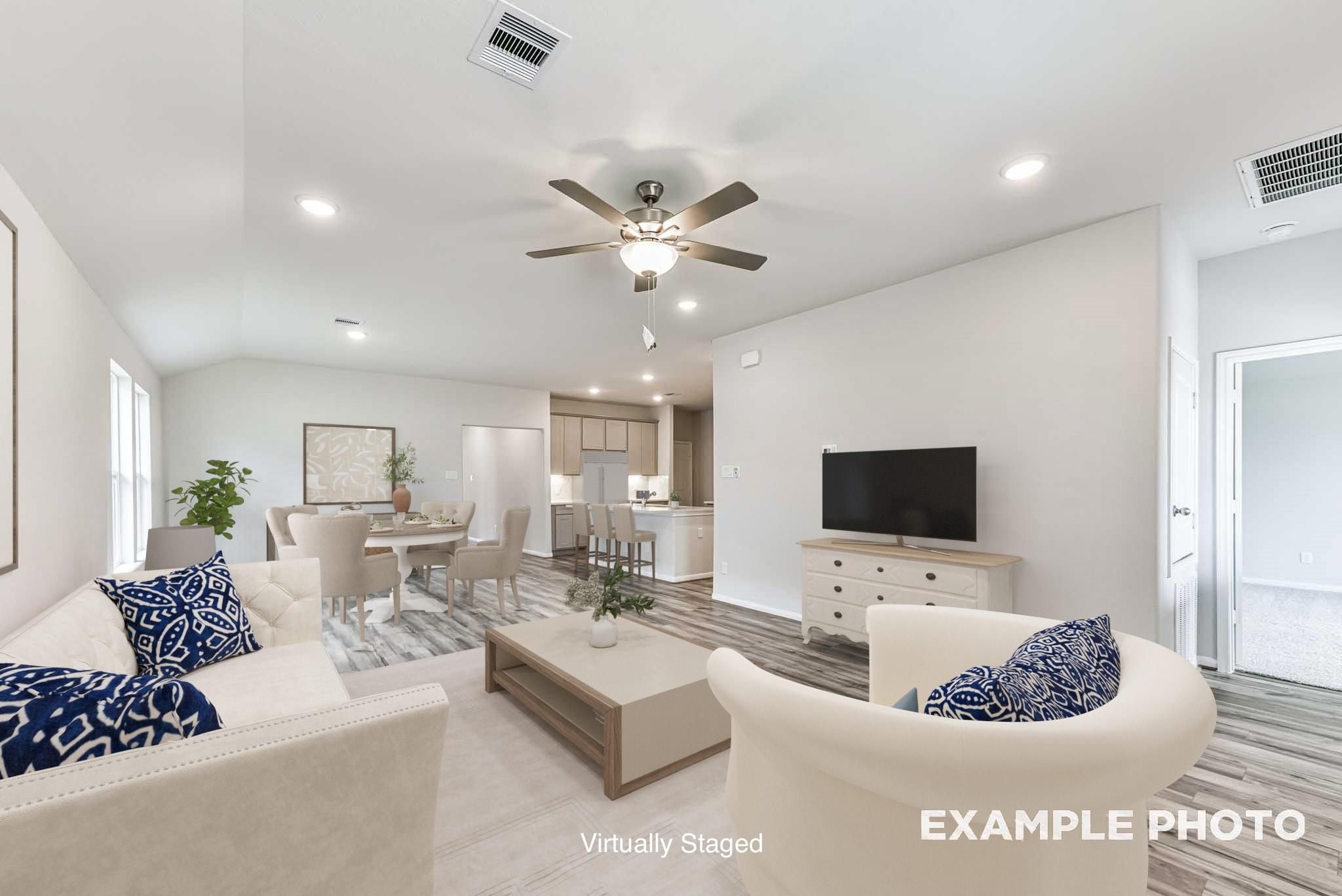 Open-concept living room and dining area in The Blanco E floor plan by Davidson Homes in Windmill Estates, Magnolia, TX.