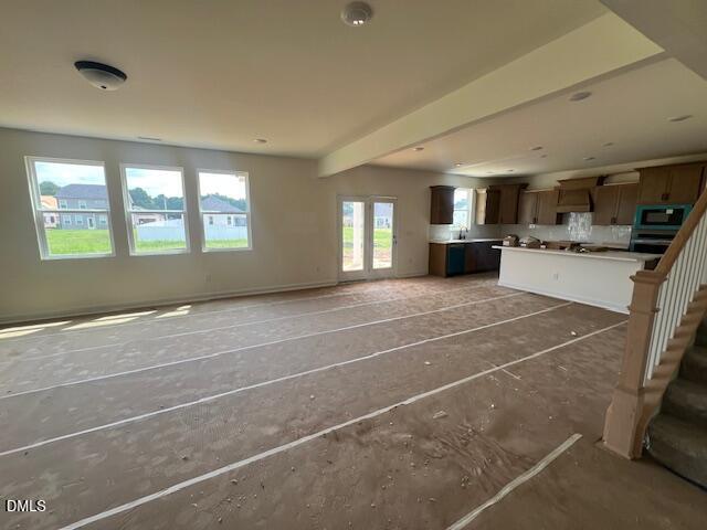 Open-concept kitchen and living area in The Hickory II B floor plan at Retreat at North Main, Lillington, North Carolina.