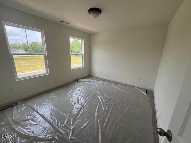 Spacious bedroom with carpet protection in Hickory II B floor plan at Retreat at North Main, Lillington, North Carolina.