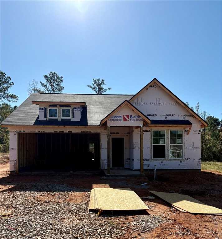 Framed single-story 4-bedroom home under construction with 2-car garage, The Aurora A by Evermore Homes in Silver Oak, Cusseta, Alabama