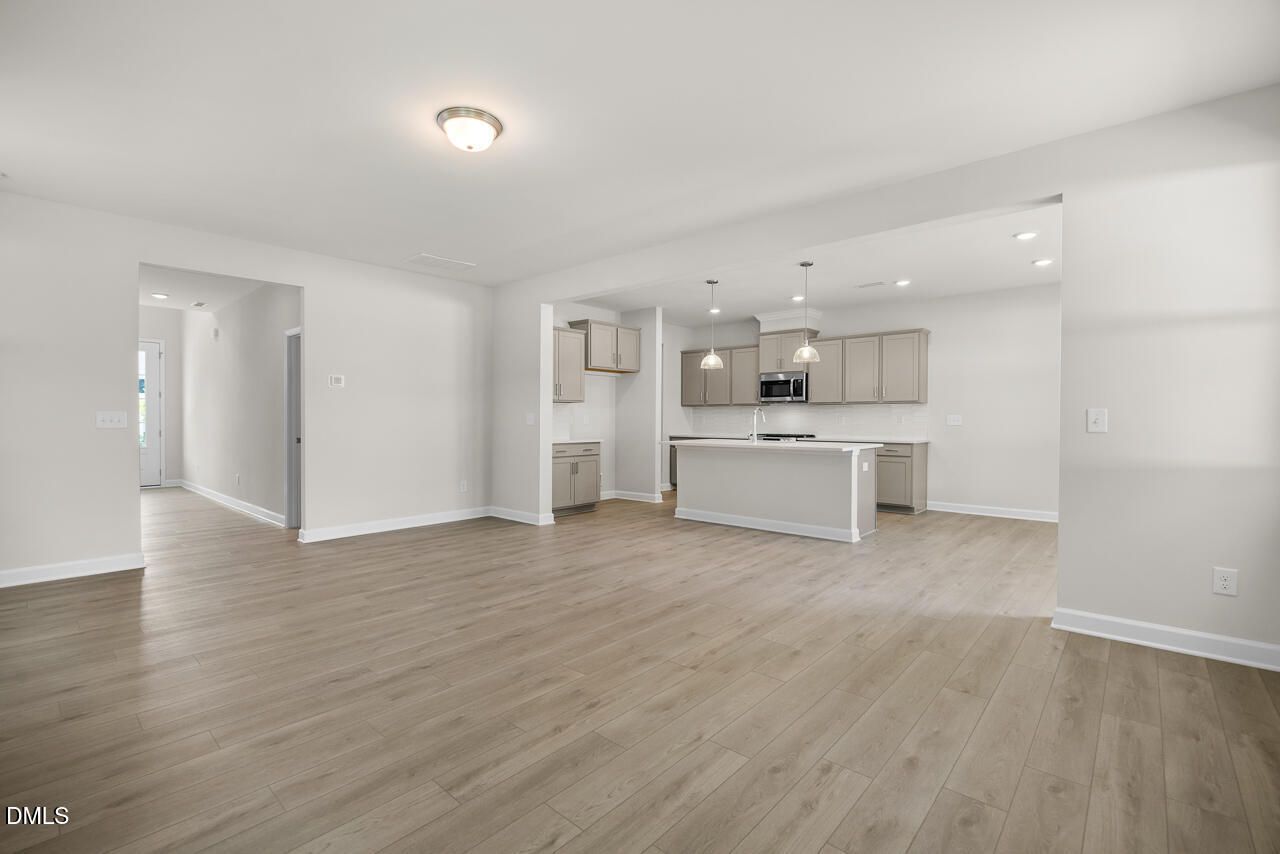 Open-concept kitchen and living area in The Gavin A floor plan at Gregory Village, Lillington, North Carolina.