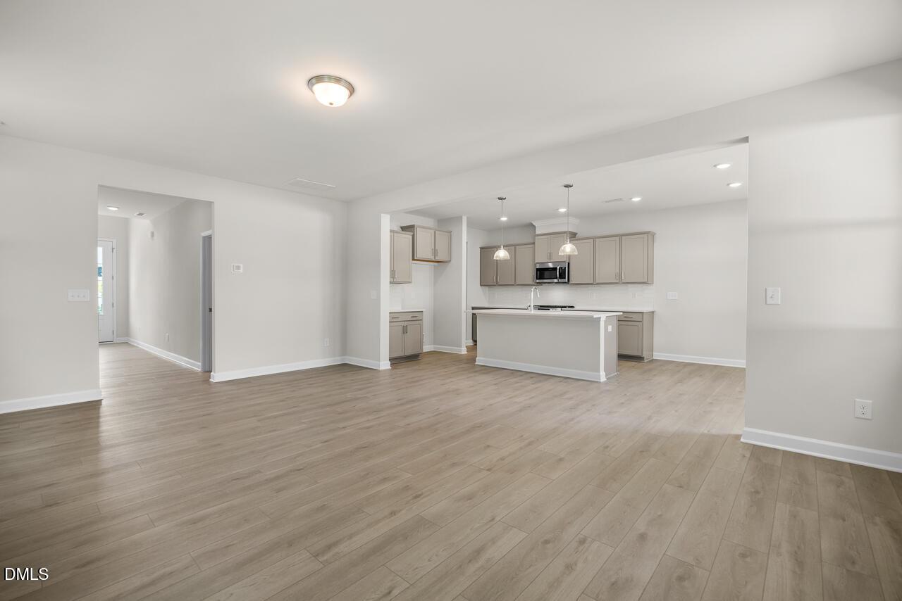 Open-concept kitchen and living area in The Gavin A floor plan at Gregory Village, Lillington, North Carolina.