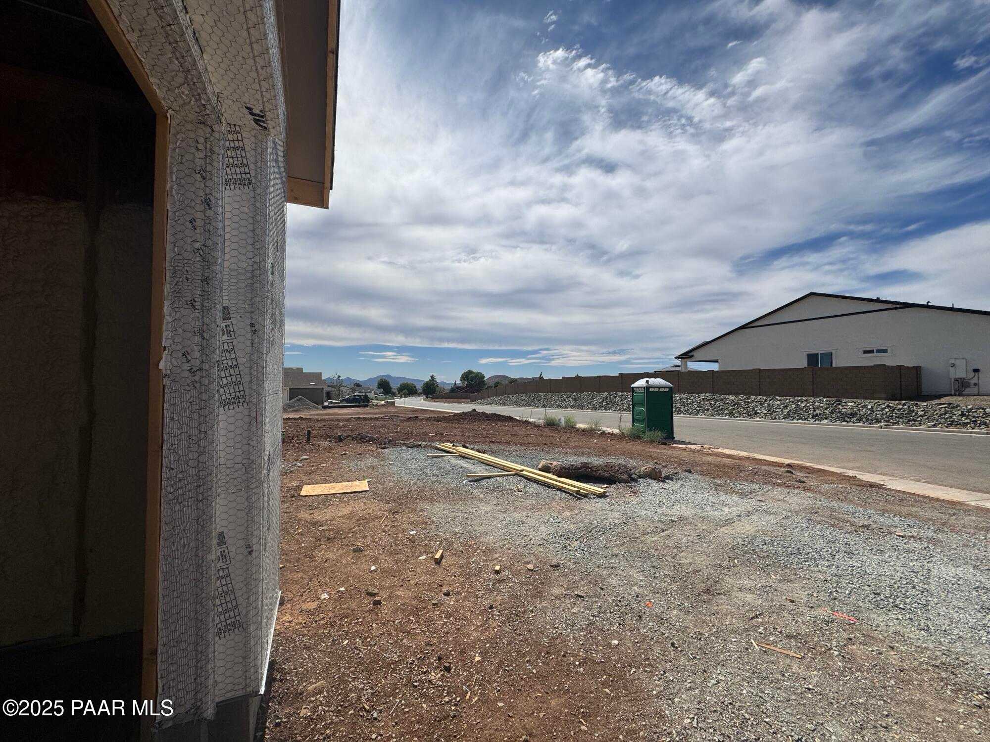 Under construction single-story home exterior with sheathing and framing in Morningstar, Prescott Valley, Arizona, Evermore Homes Sunrise A