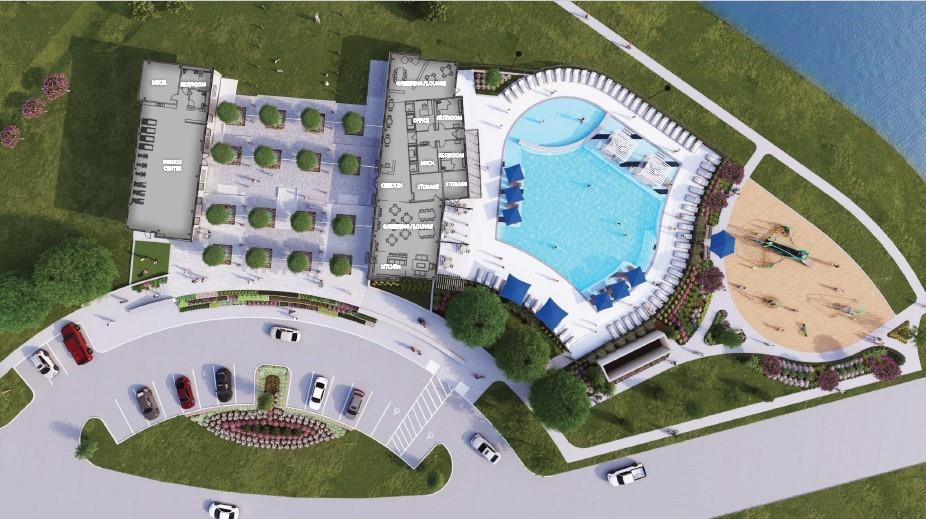 Aerial view of Sundance Cove amenity center with resort-style pool, clubhouse, fitness center and playground in Crosby, Texas