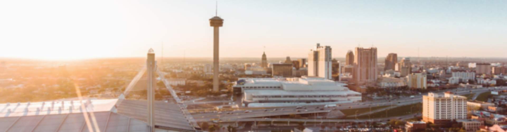 Panoramic sunset skyline of San Antonio Region with Alamodome and Tower of the Americas