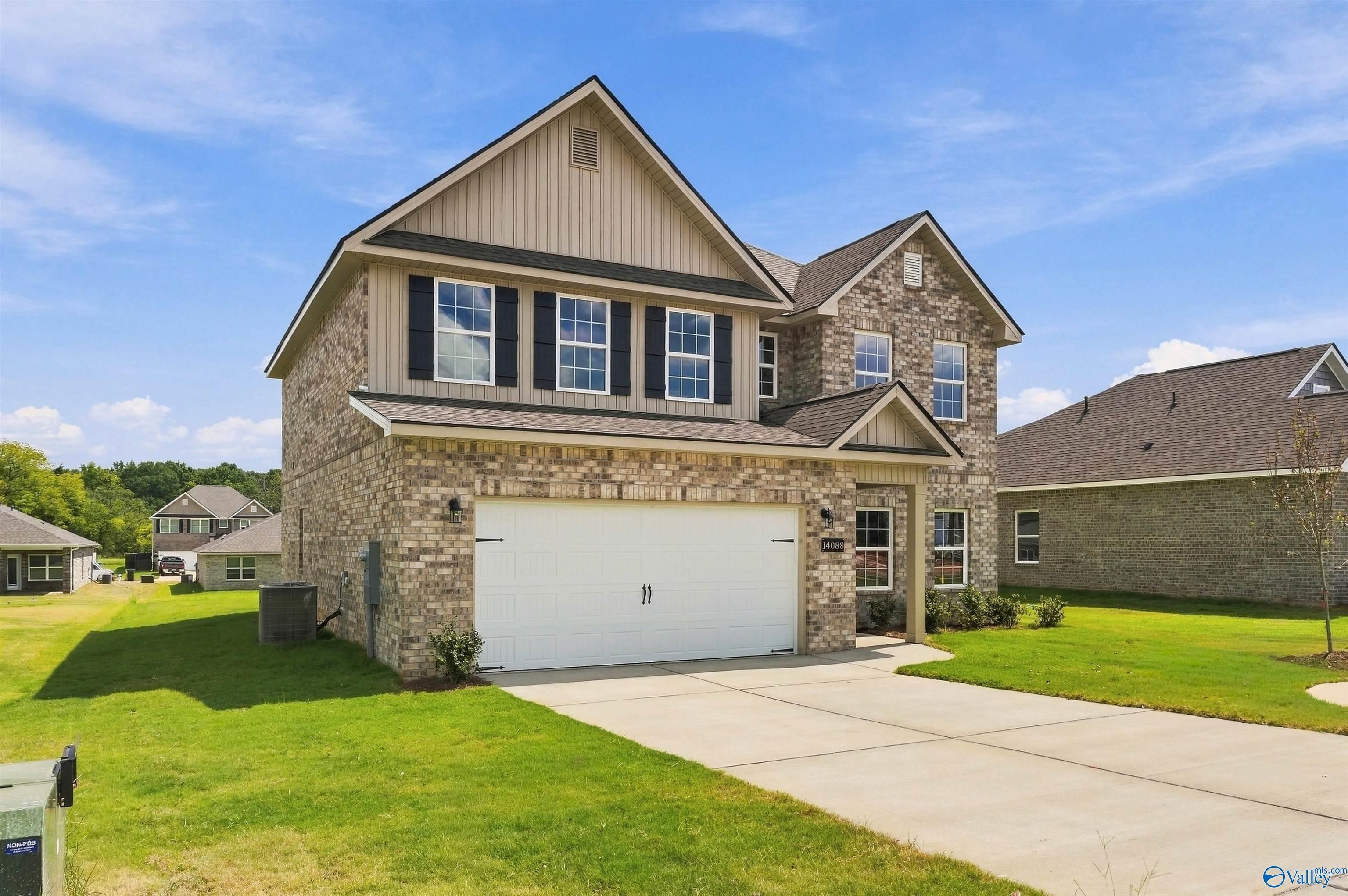 Two-story brick new construction home with 2-car garage in The Meadows by Davidson Homes, Athens, Alabama
