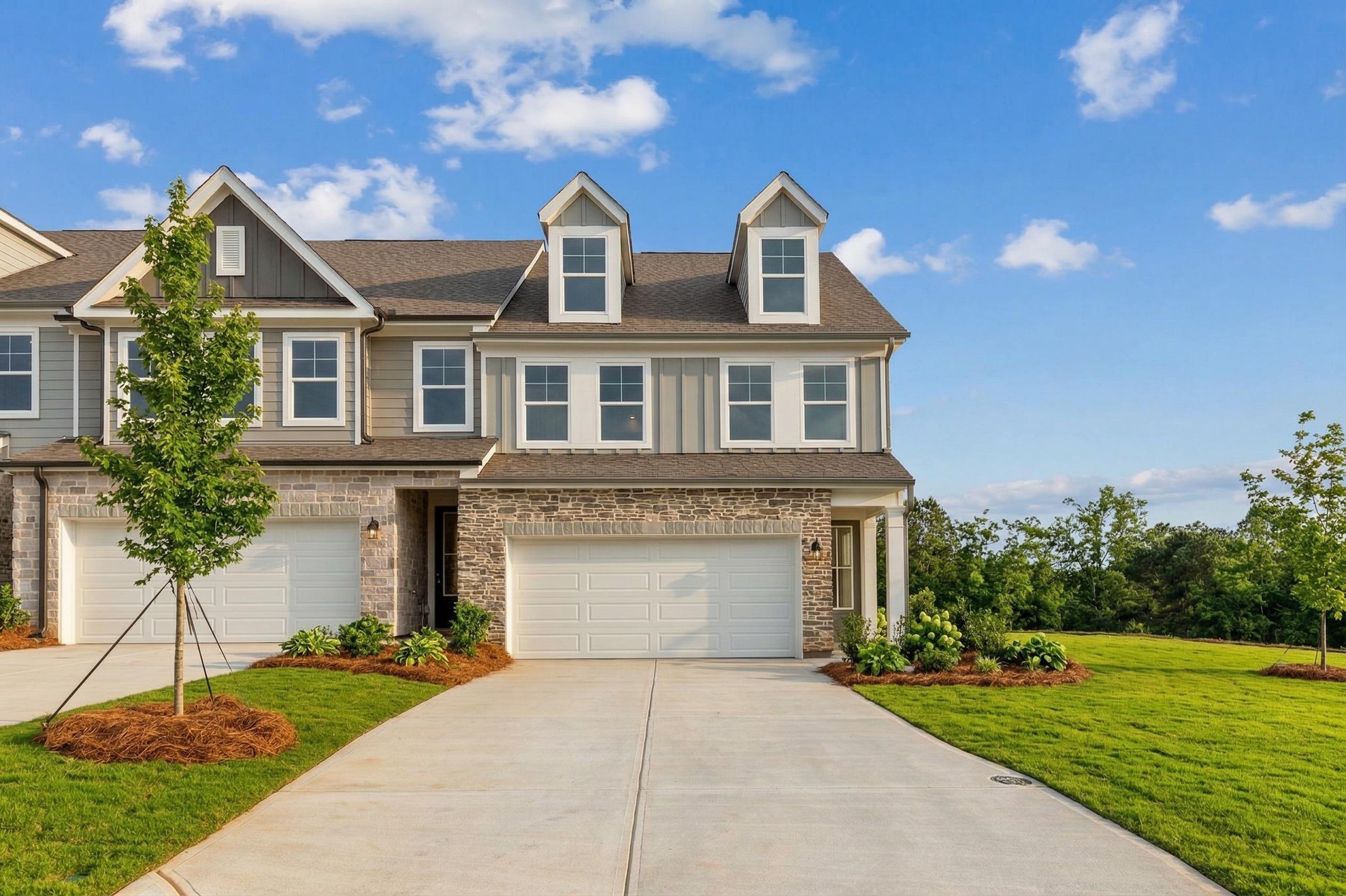 Modern two-story Davidson Homes The Durham B with 2-car garage, stone accents, and landscaped yard in Hemingway, Cumming, Georgia