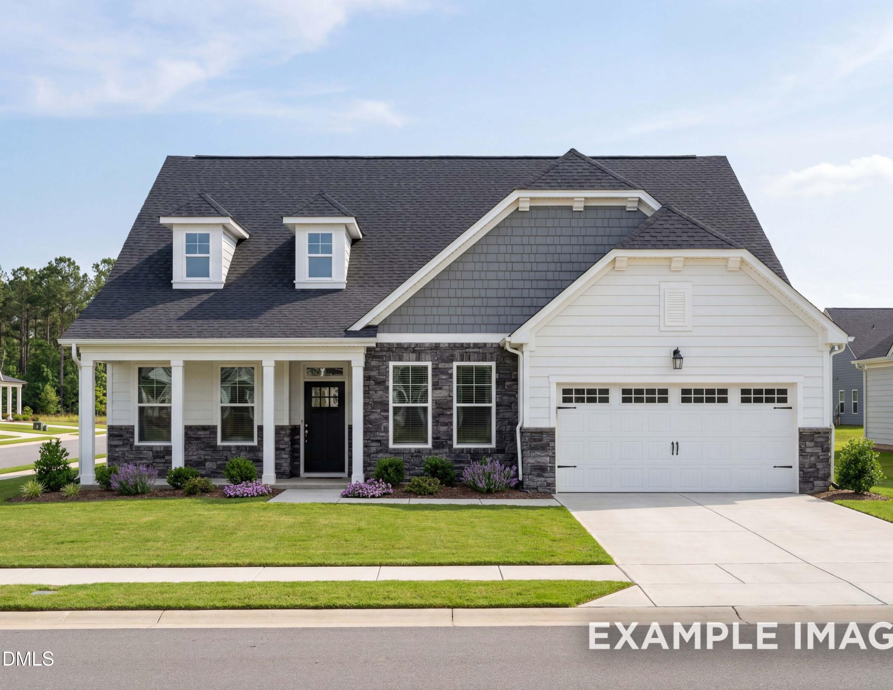 Modern Magnolia B exterior by Davidson Homes: white siding, gray gables, stone accents, 2-car garage, landscaped yard in Lillington, NC