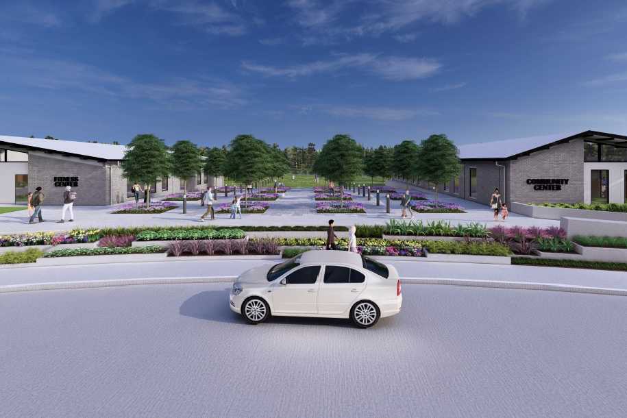 Modern clubhouse at Sundance Cove in Crosby Texas featuring sloped roofs, vibrant flower beds, walking paths and lush trees