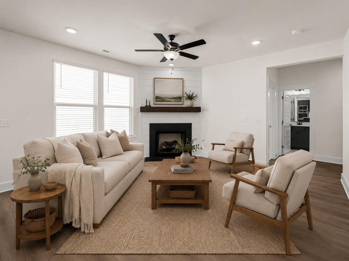 Modern living room with fireplace and shiplap in The Willow floor plan by Davidson Homes, Woods Crossing, Gallatin, TN.