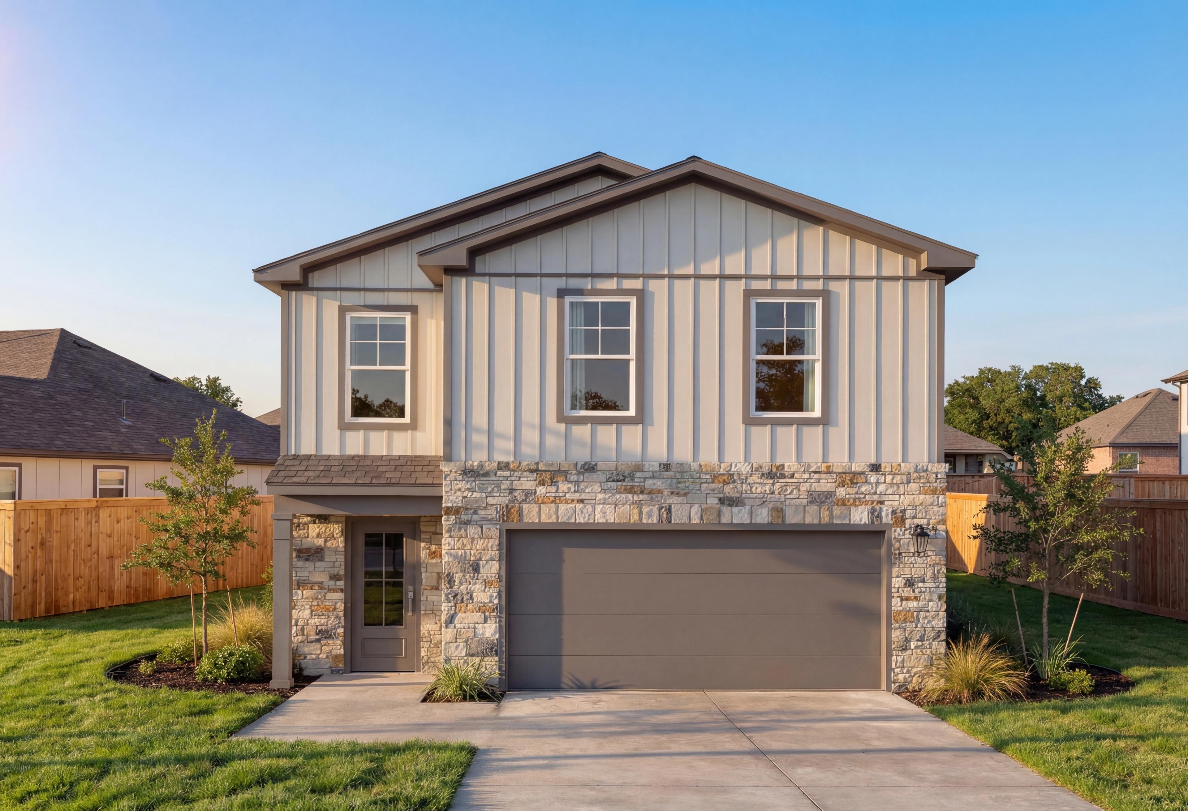 Two-story The Blanco E elevation by Davidson Homes in Magnolia Texas featuring stone accents beige siding 2-car garage and landscaped front yard
