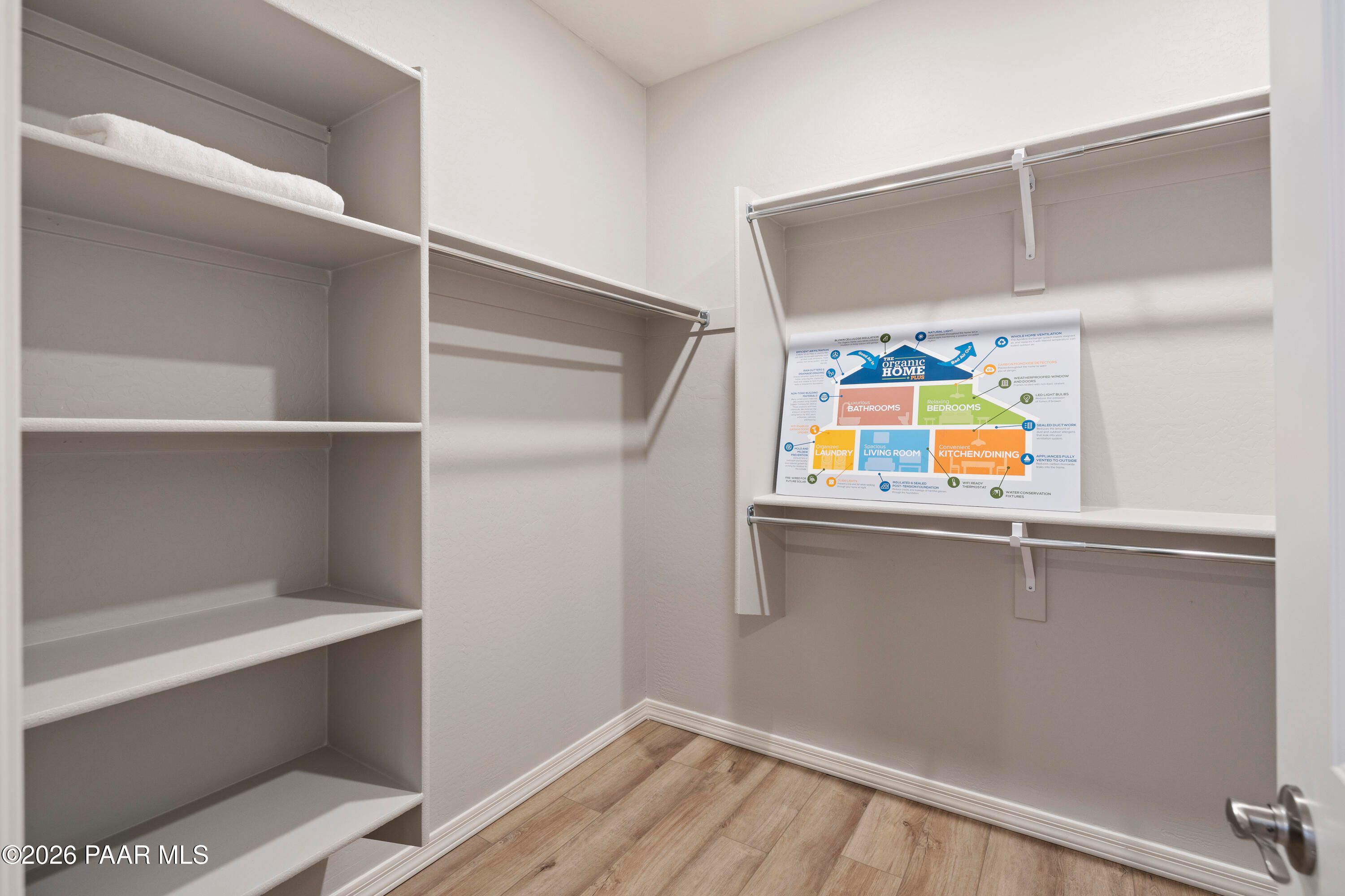 Walk-in closet with built-in shelving in Harmony A floor plan at Pronghorn Ranch, Prescott Valley, Arizona.