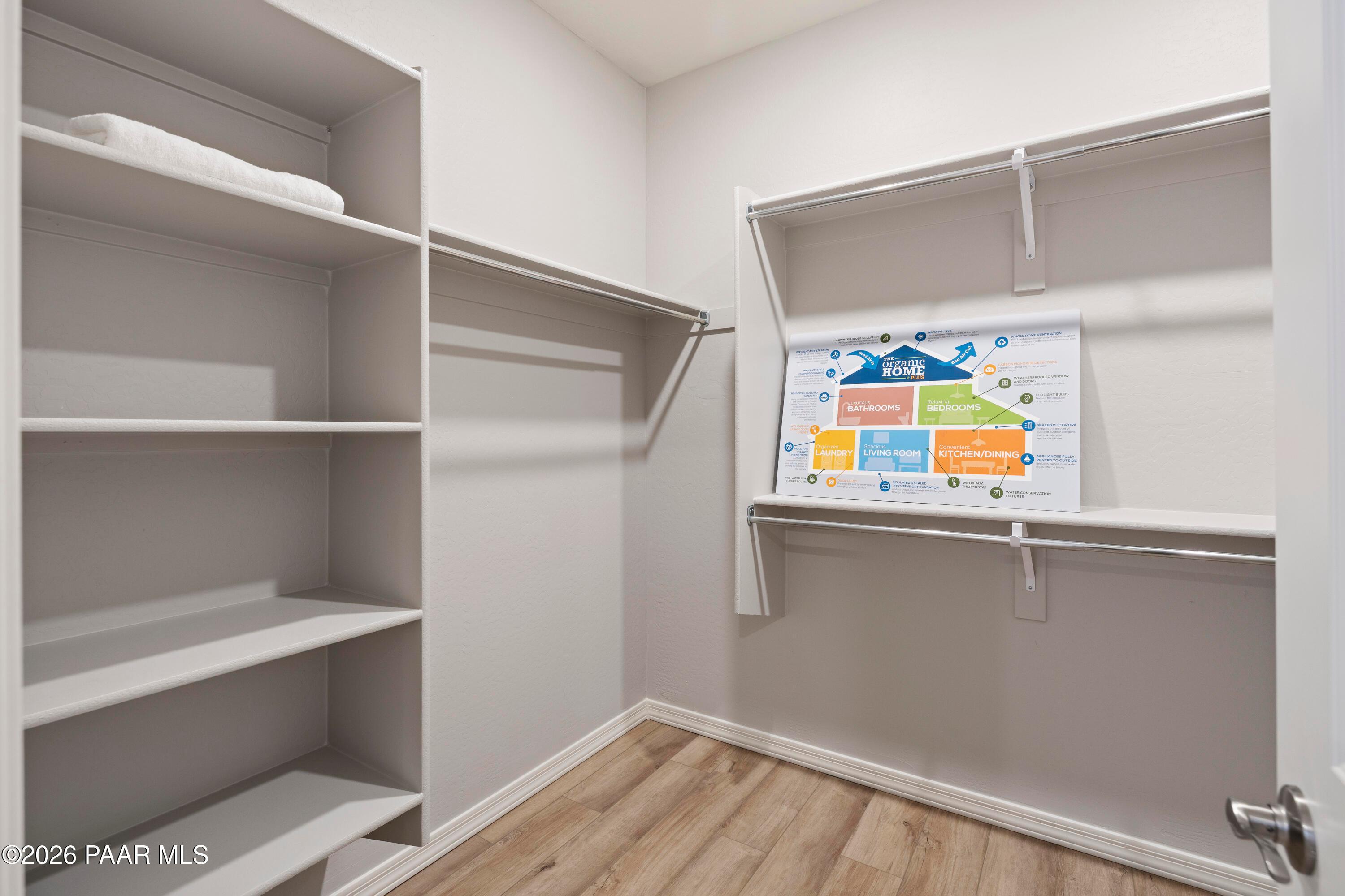 Walk-in closet with built-in shelving in Harmony A floor plan at Pronghorn Ranch, Prescott Valley, Arizona.