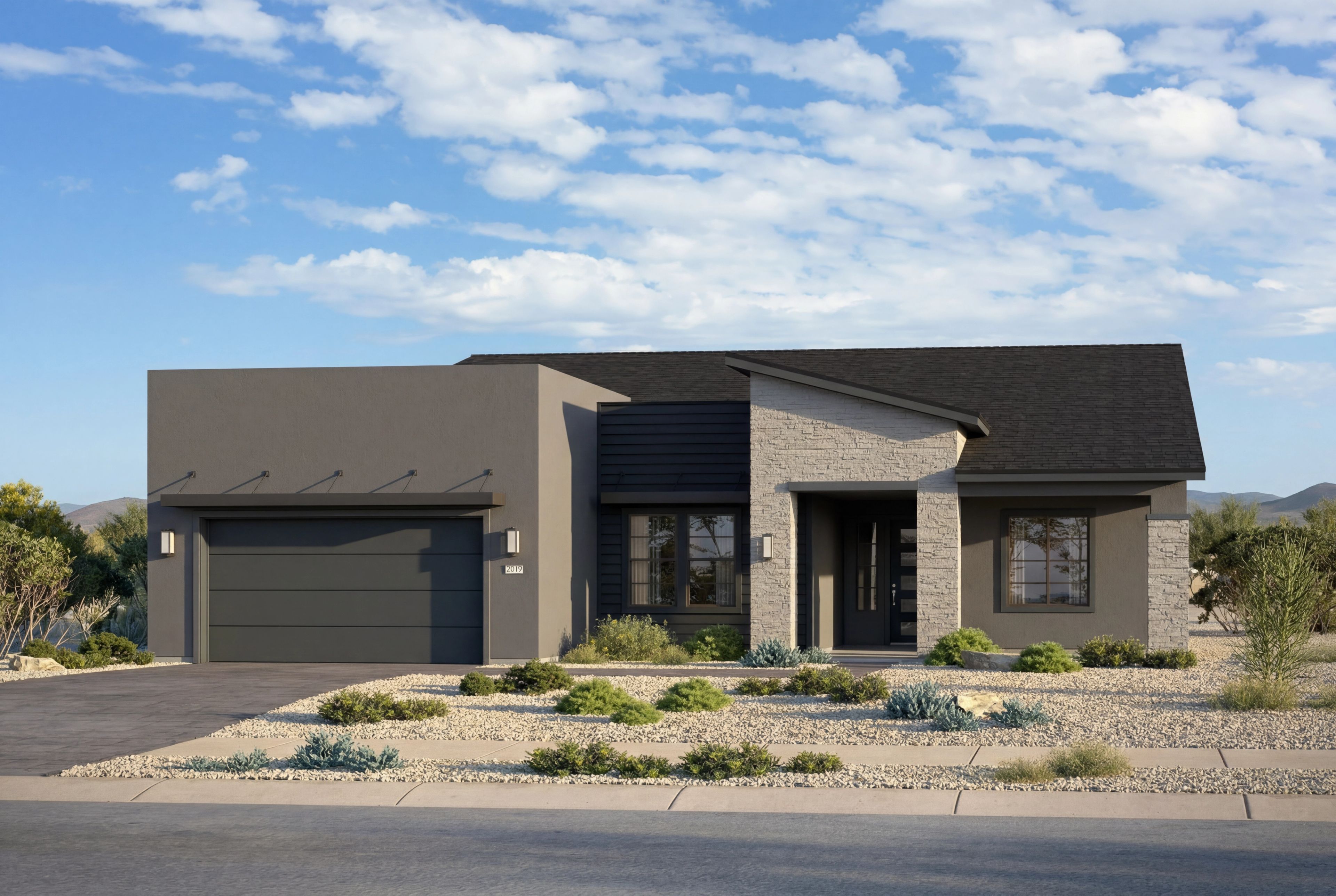 Modern exterior of The Soleil D by Davidson Homes featuring a stone facade, dark trim, and desert landscaping in Prescott.