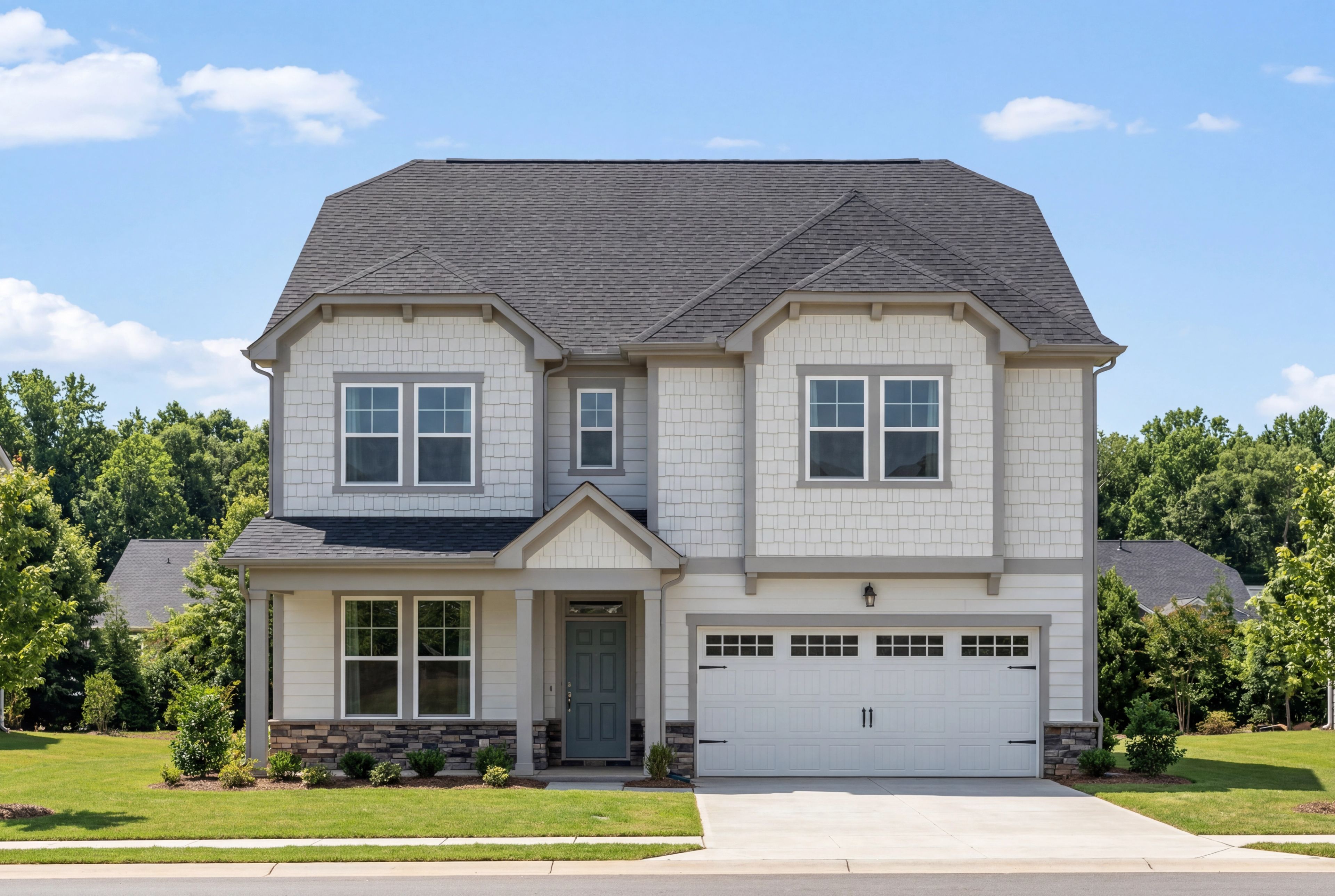 Two-story Beech C home elevation with white siding, stone accents, two-car garage, and front porch in Belmont NC