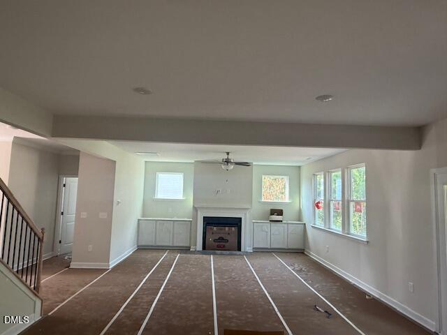 Spacious living room with fireplace and custom built-ins in Hickory II B floor plan at Montrose, Aberdeen, North Carolina.