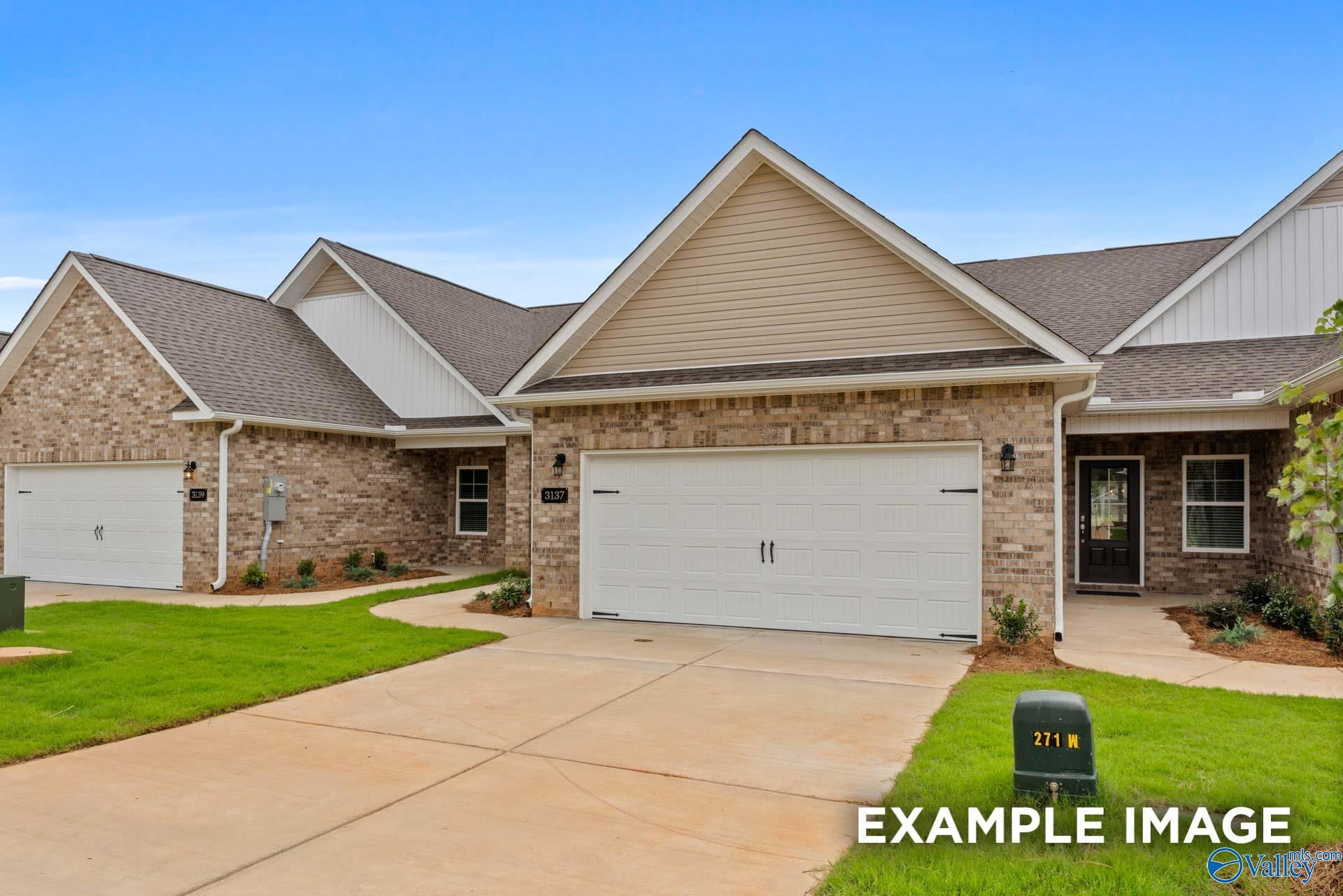 Modern brick single-story home with 2-car garage and driveway, The Cumberland C by Davidson Homes in Decatur, Alabama