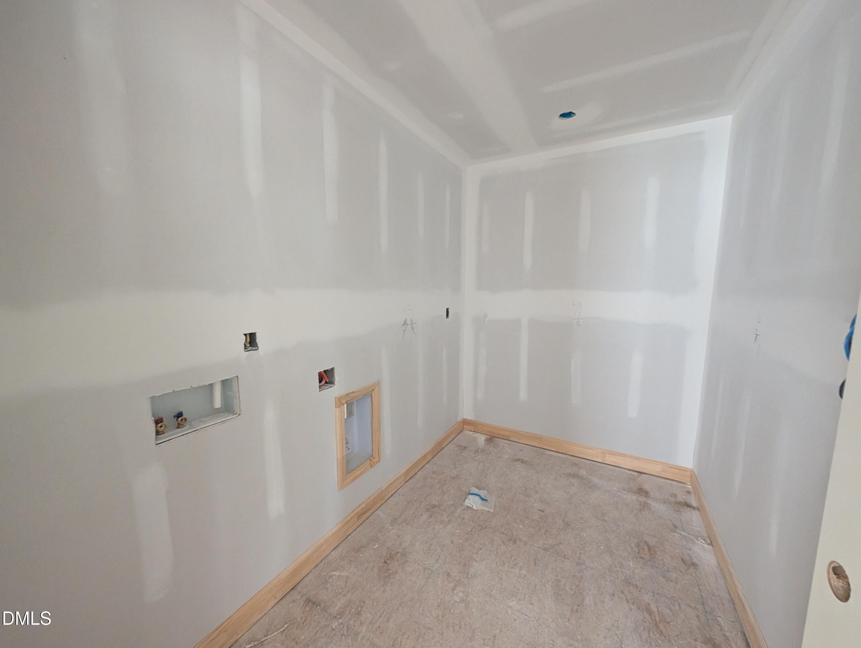 Unfinished bathroom under construction with plumbing rough-ins in Davidson Homes The Beech floor plan, Wendell Ridge, North Carolina