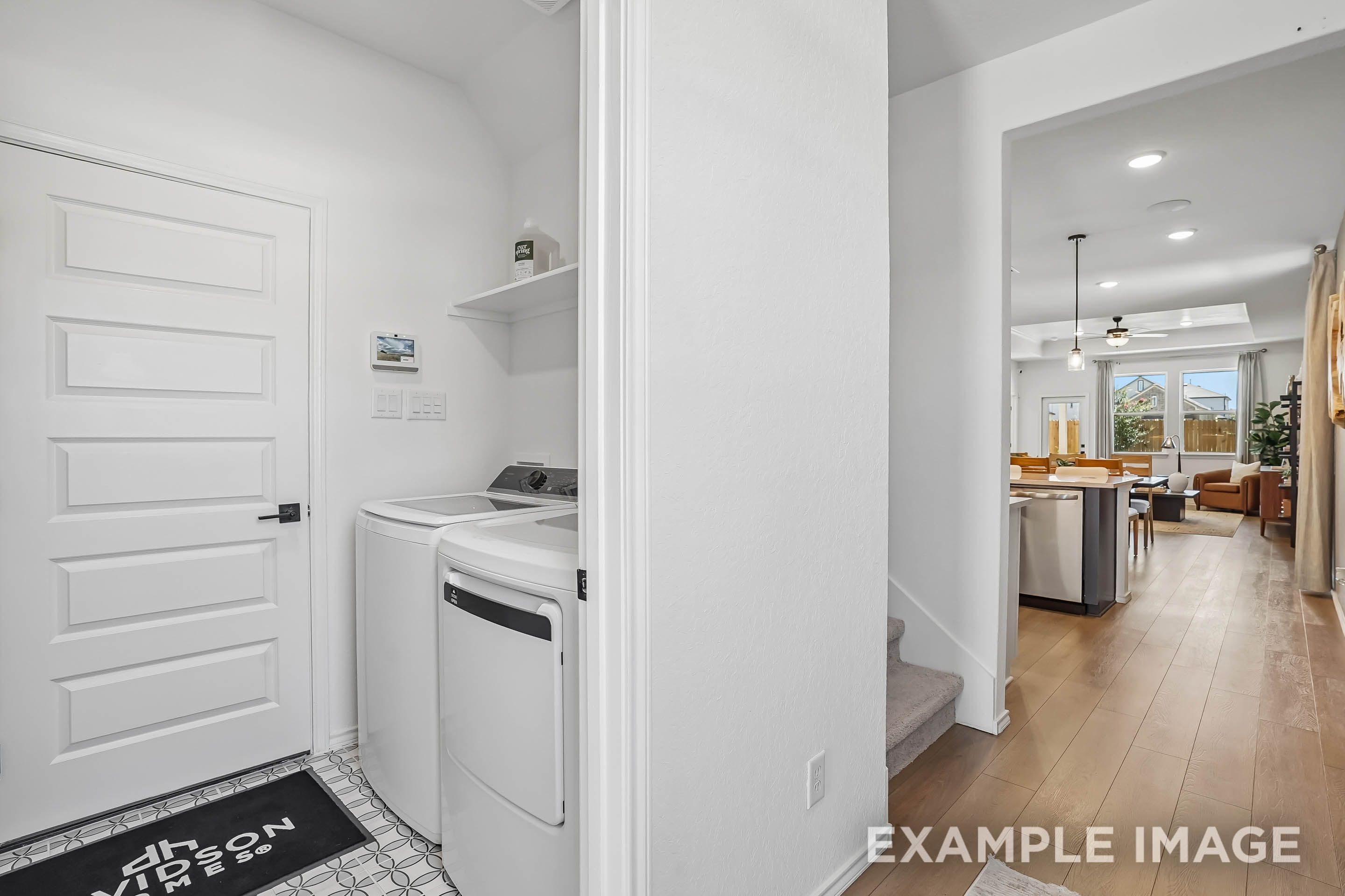 Laundry room with washer and dryer in The Pinecrest D floor plan by Davidson Homes in San Antonio, Texas.