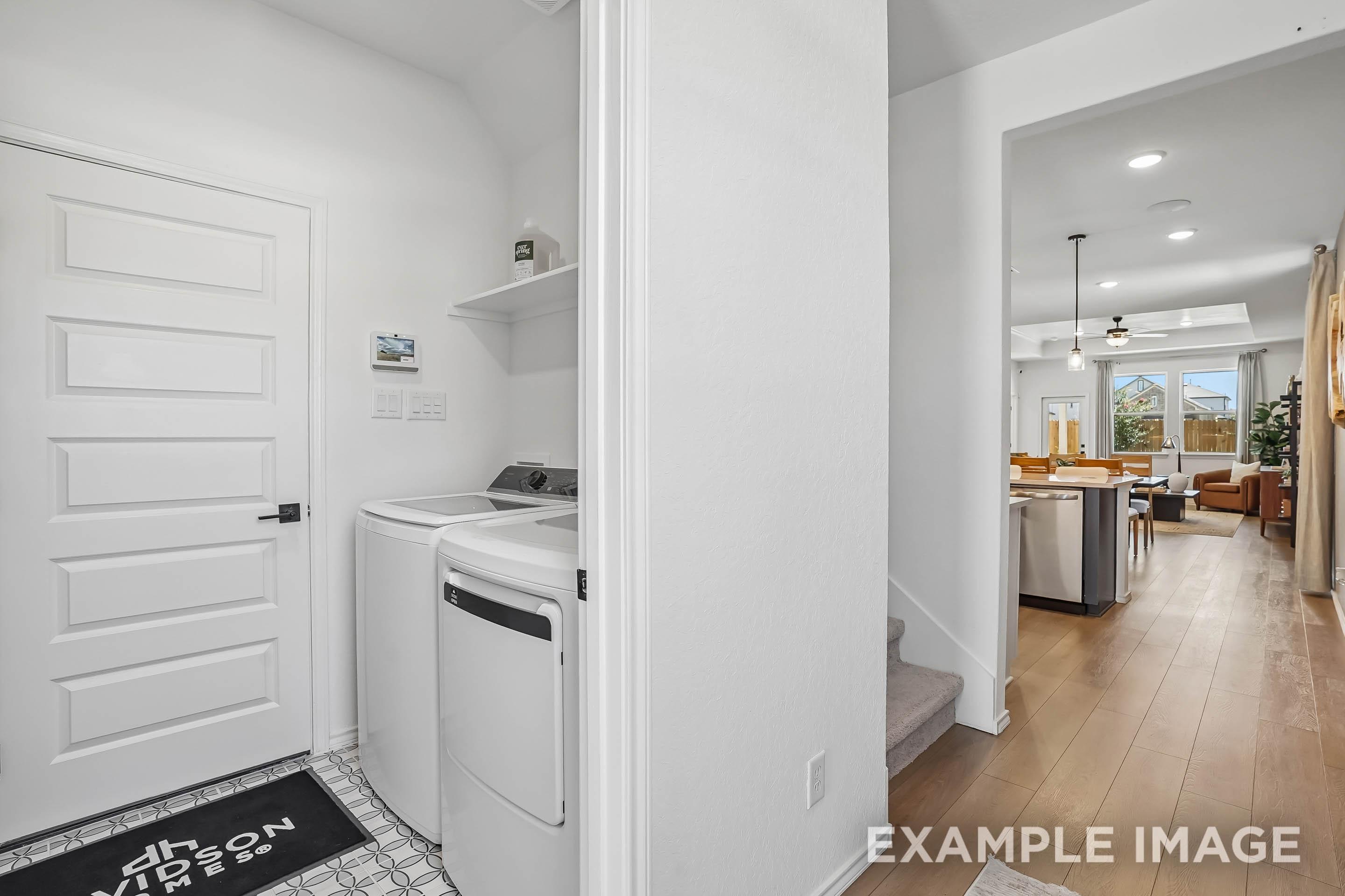 Laundry room with washer and dryer in The Pinecrest D floor plan by Davidson Homes in San Antonio, Texas.