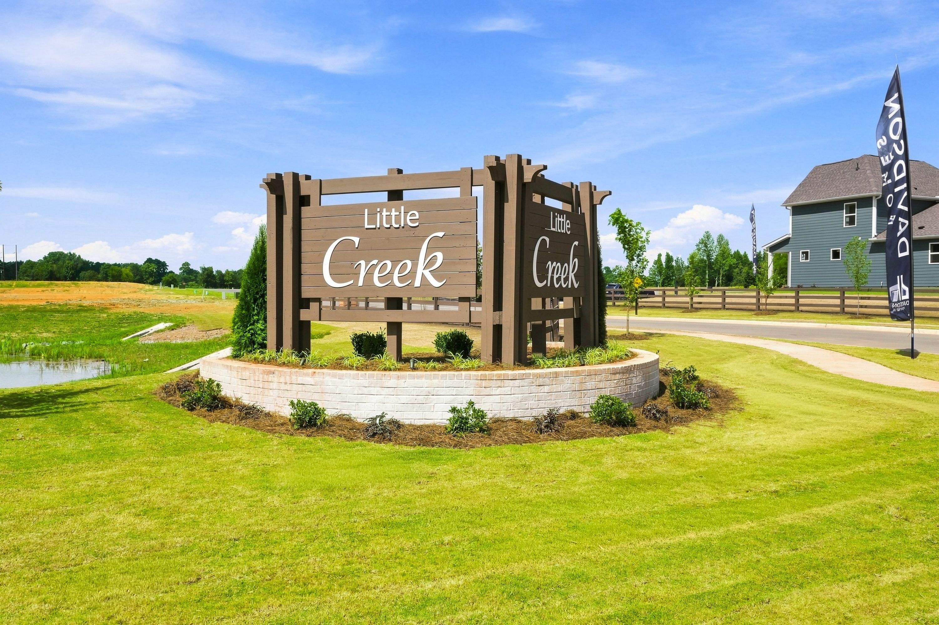 Little Creek community entrance sign in Arab, Alabama featuring Davidson Homes branding and landscaped lawn.