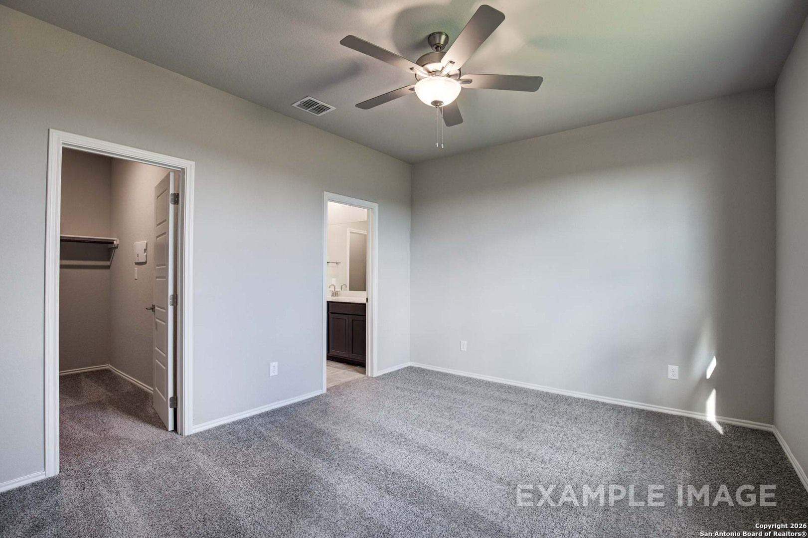 Guest bedroom featuring ceiling fan, en-suite bath with vanity, and closet in Davidson Homes The Frio B, Agave, San Antonio