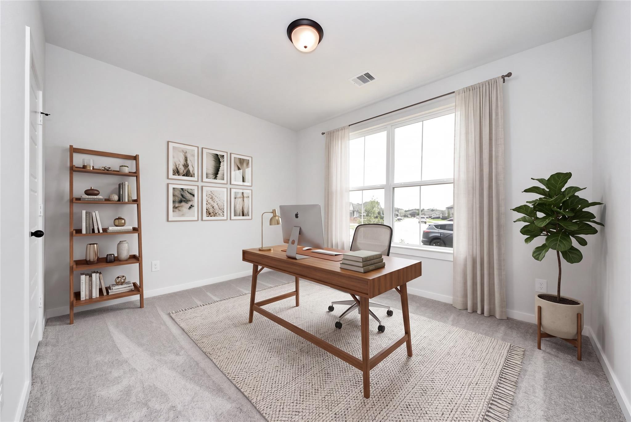 Bright home office with wooden desk, gallery wall, ladder shelf, and large window in Davidson Homes The Daphne F, Crosby, Texas