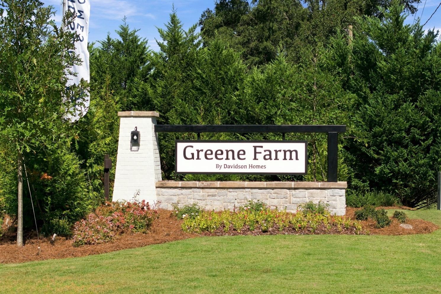 Greene Farm community entrance sign by Davidson Homes in Cartersville, Georgia with stone monument and landscaped flower beds