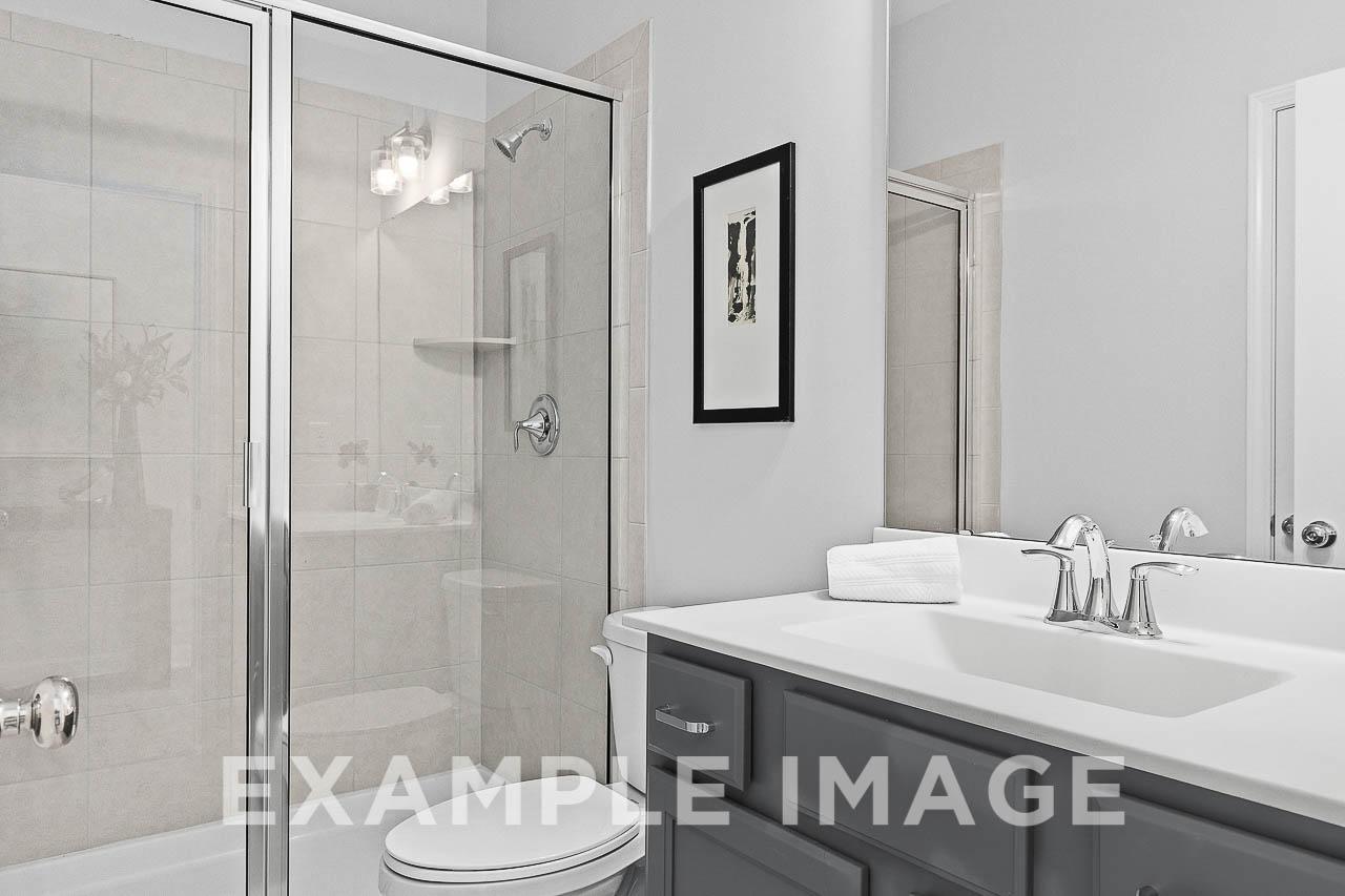 Davidson Homes the Chestnut Plan Guest Bathroom with toilet, single vanity and walk-in shower