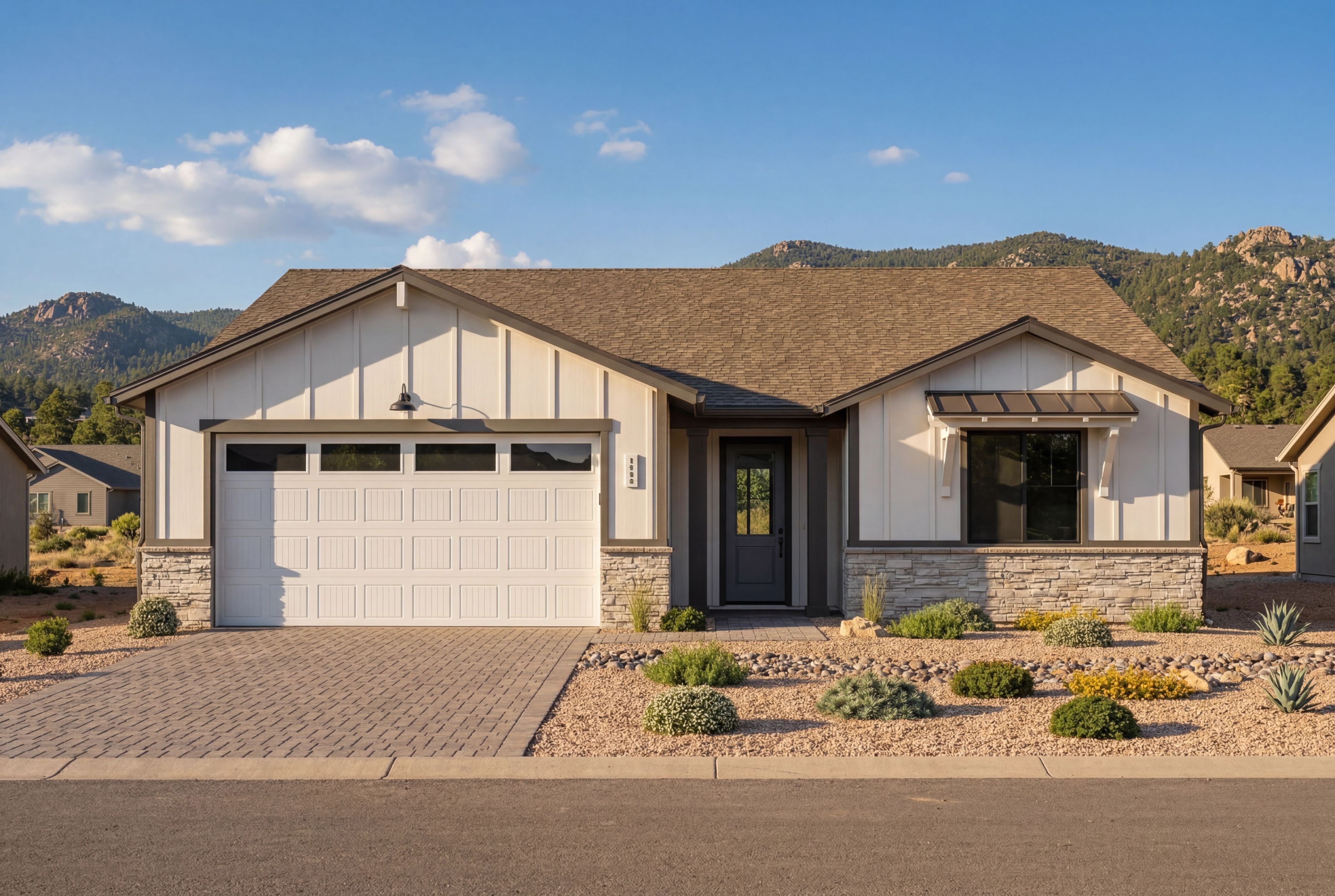 Modern farmhouse elevation of The Durango II by Davidson Homes featuring a 3-car garage and stone accents in Prescott, AZ.