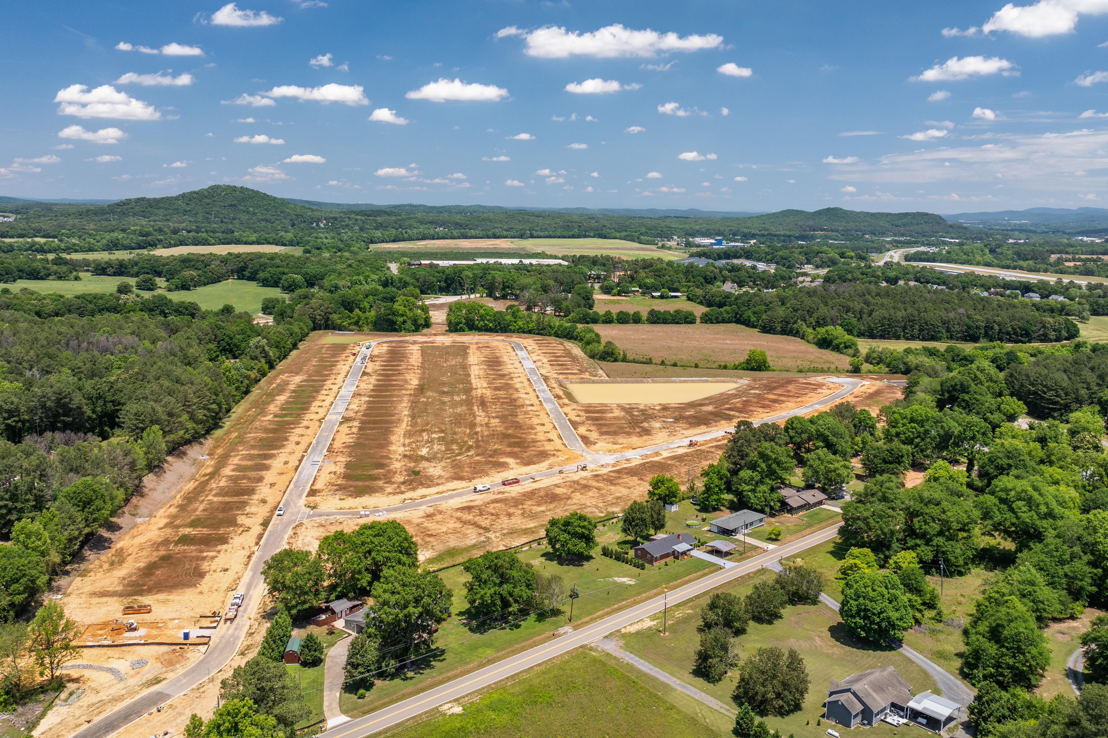 Aerial view of Greene Farm community land development in Cartersville, GA, featuring new roads by Davidson Homes.