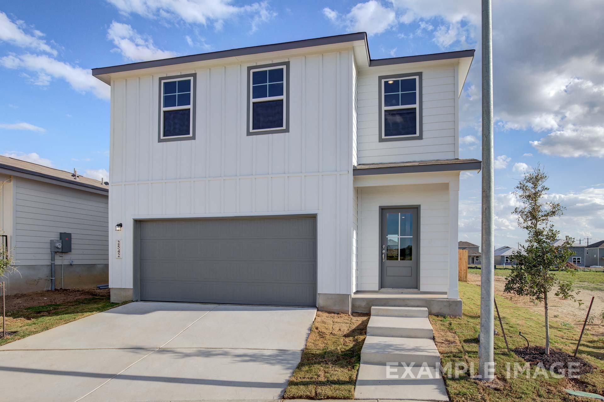 Two-story Blanco A home elevation with white board-and-batten siding, dark-framed windows, gray two-car garage, and concrete driveway in San Antonio