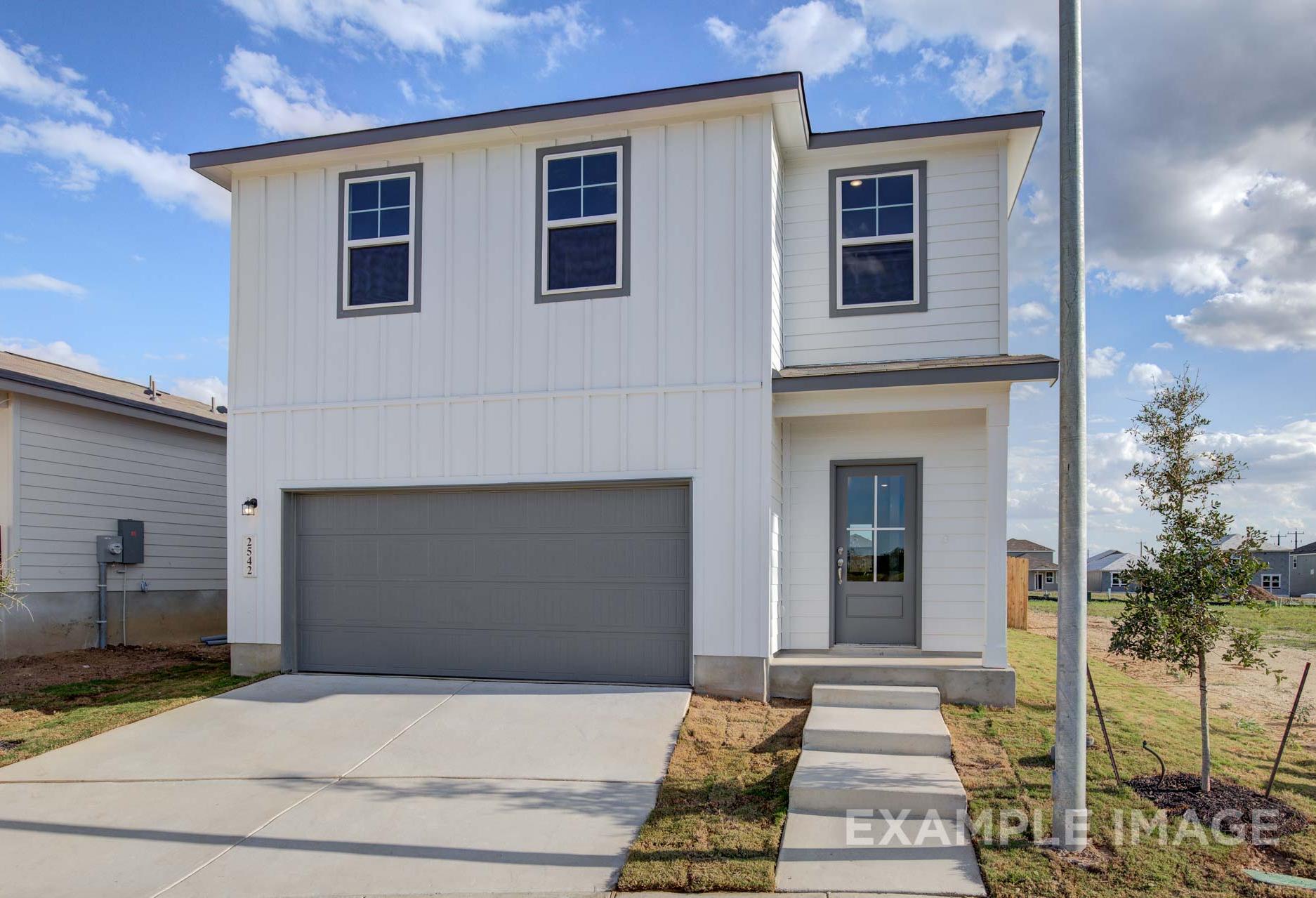 Two-story Blanco A home elevation with white board-and-batten siding, dark-framed windows, gray two-car garage, and concrete driveway in San Antonio
