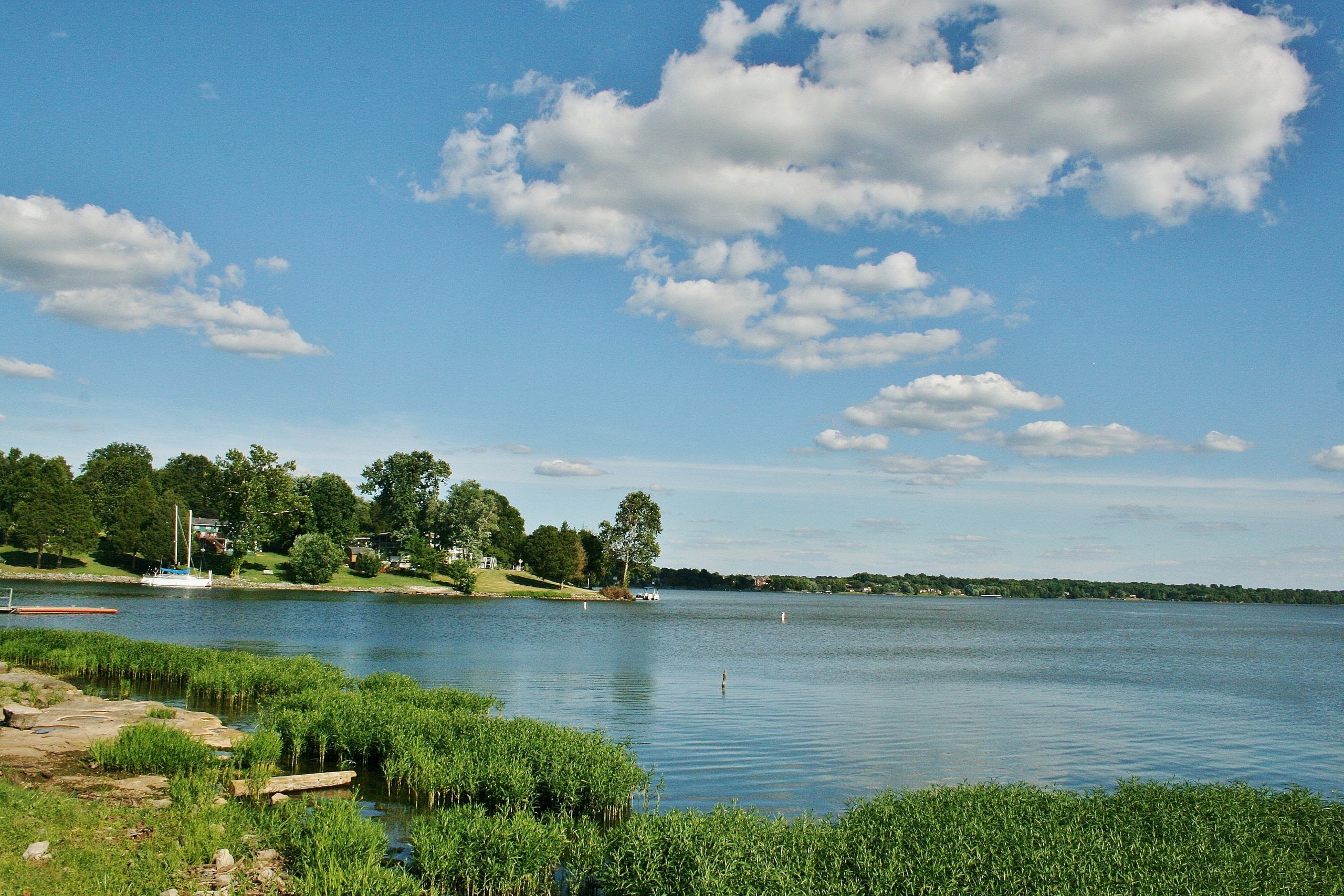 Scenic waterfront view at Jackson Village in Hendersonville, Tennessee, featuring a serene lake and lush green shoreline.