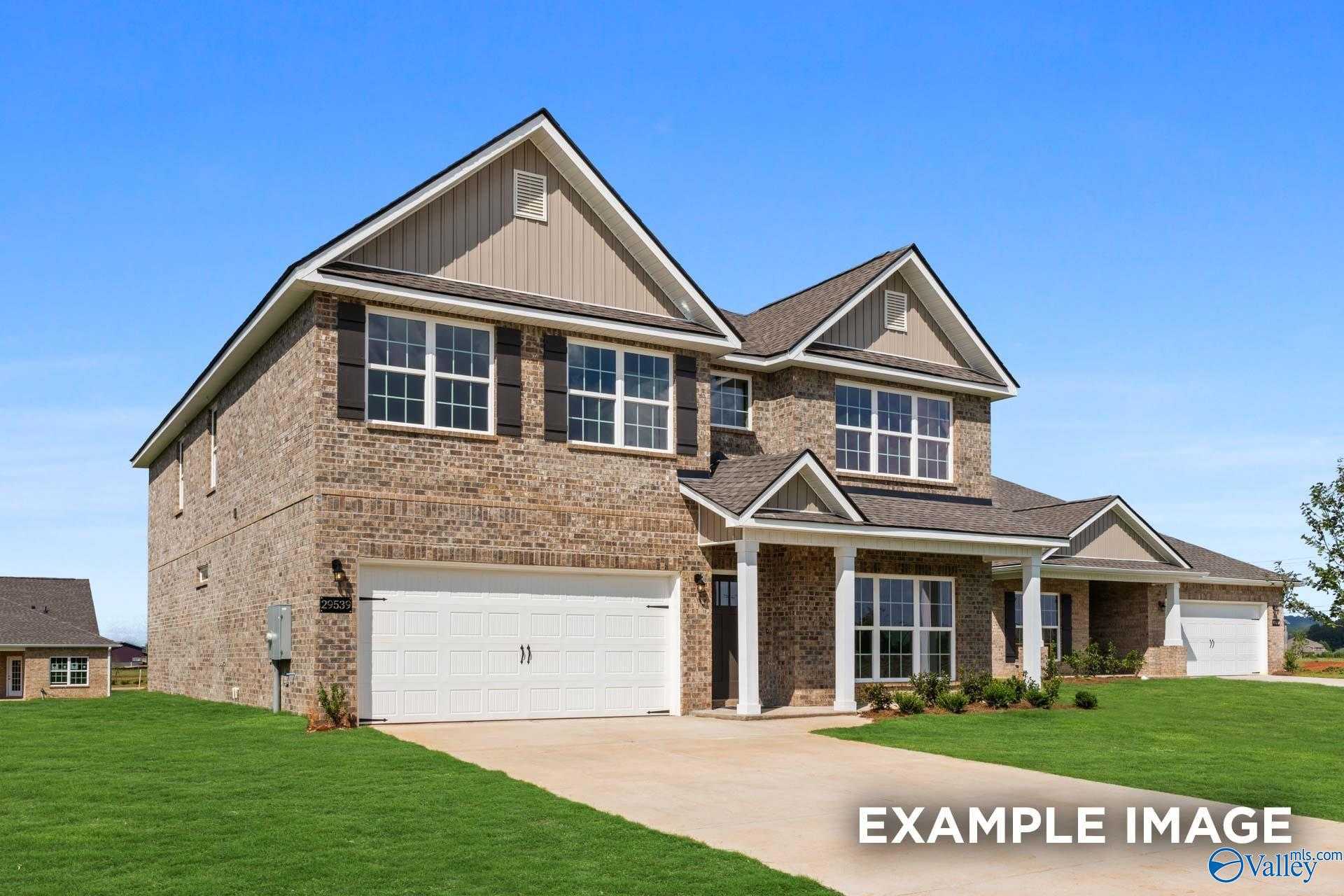 Brick single-story home with gabled roof, 2-car garage, columned porch in Jaguar Hills, Huntsville, Alabama - Davidson Homes Richmond D