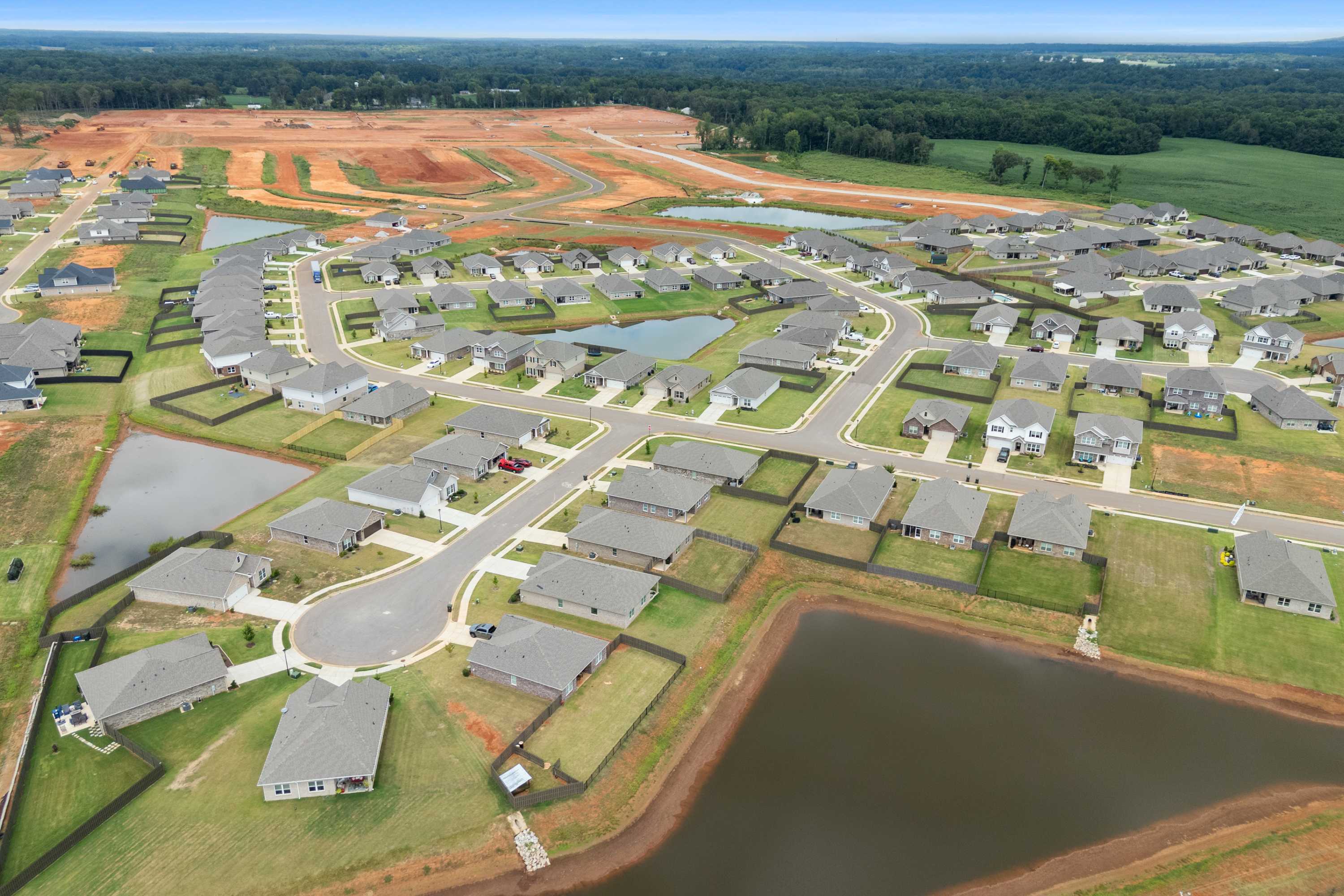 Aerial view of Heritage Lakes neighborhood in New Market Alabama with new homes ponds and green spaces
