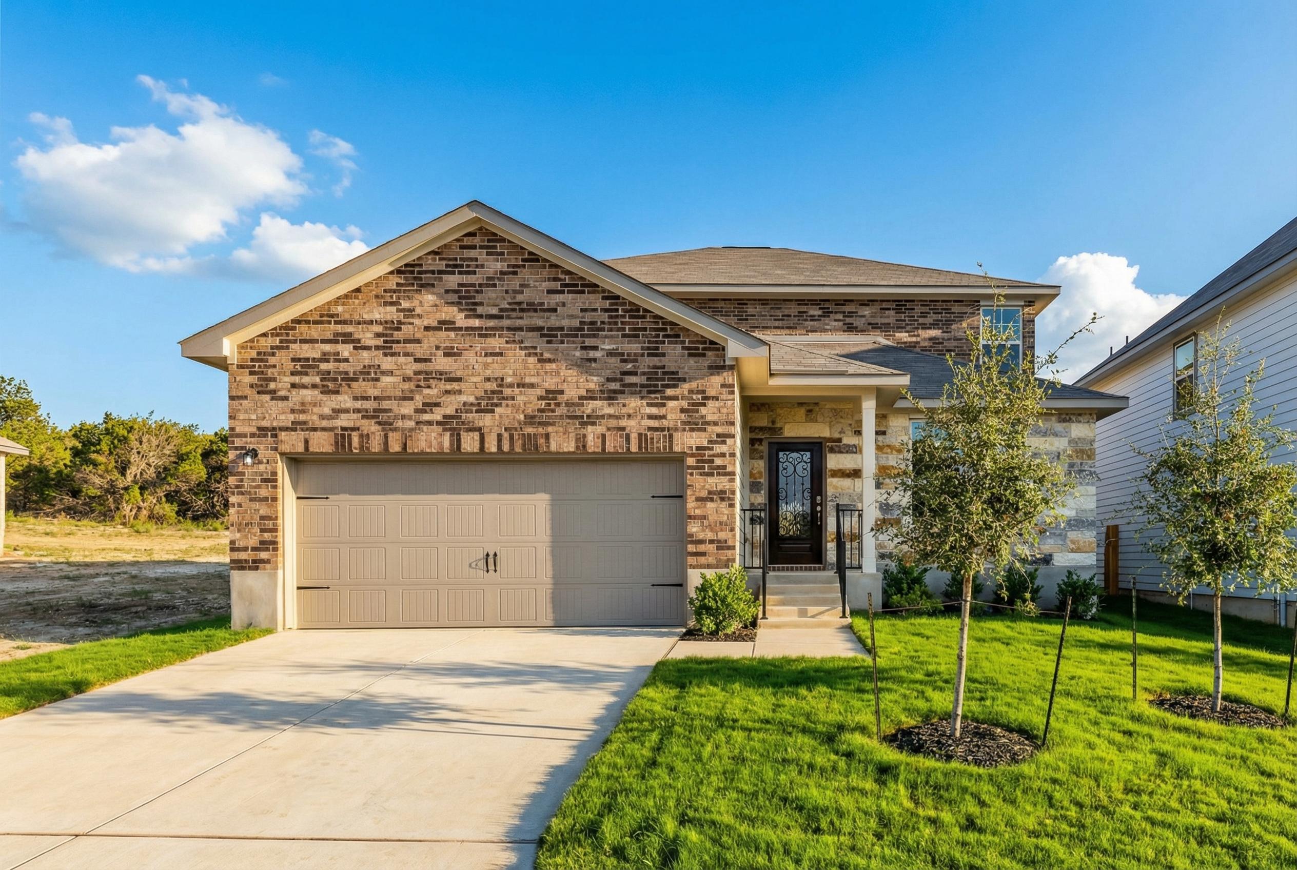 Modern two-story brick home with 2-car garage, front porch, and landscaped yard in Royal Crest, San Antonio, Texas - Davidson Homes The Douglas F