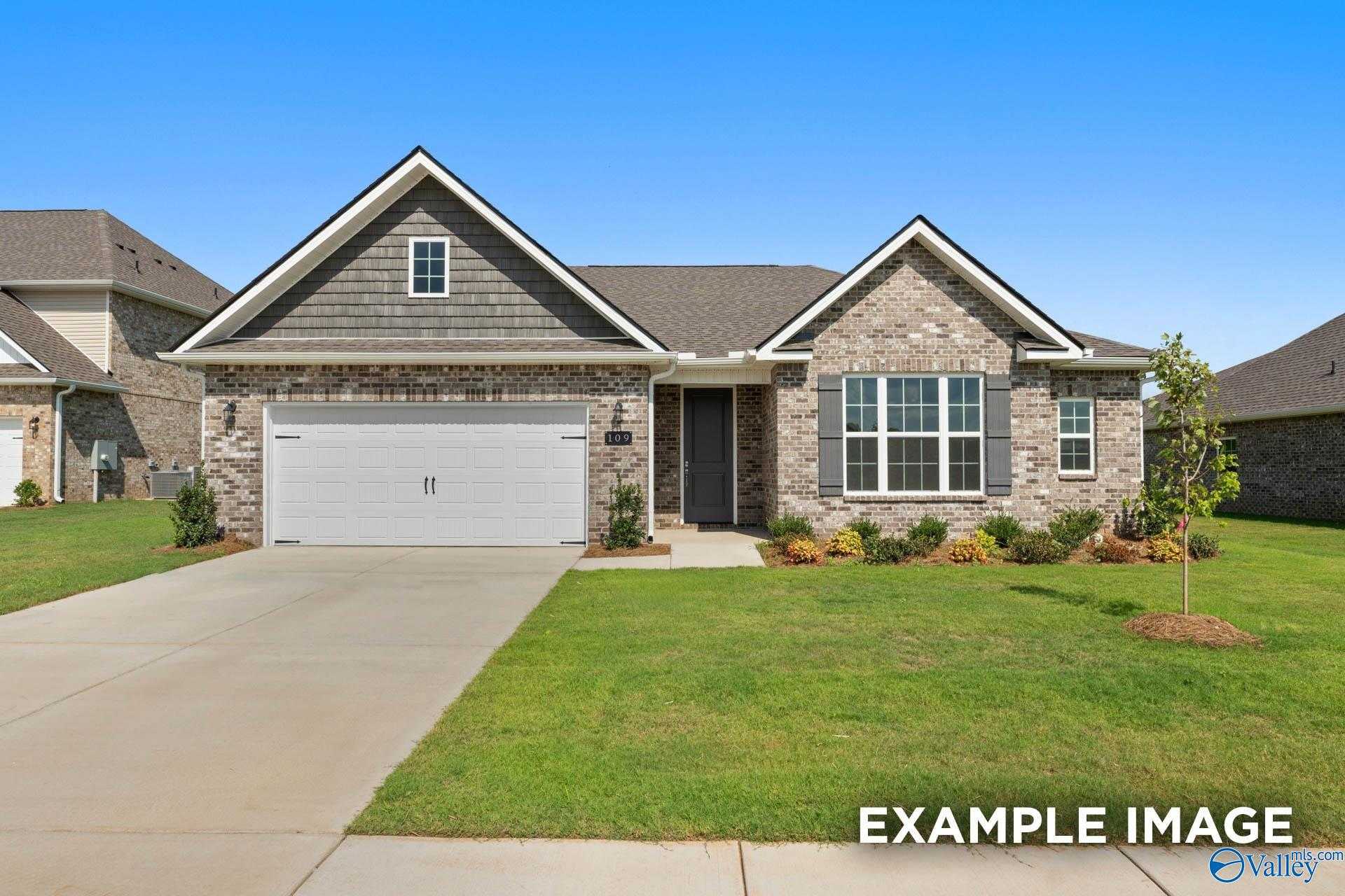 Single-story 3-bed, 2-bath brick home with 2-car garage, gabled roof, and landscaped yard in Cain Park, Hartselle, Alabama