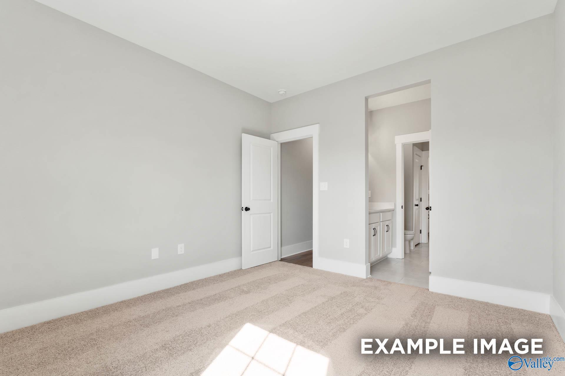 Spacious secondary bedroom with ensuite bathroom access in The Finleigh floor plan at Briercreek, Meridianville, Alabama.