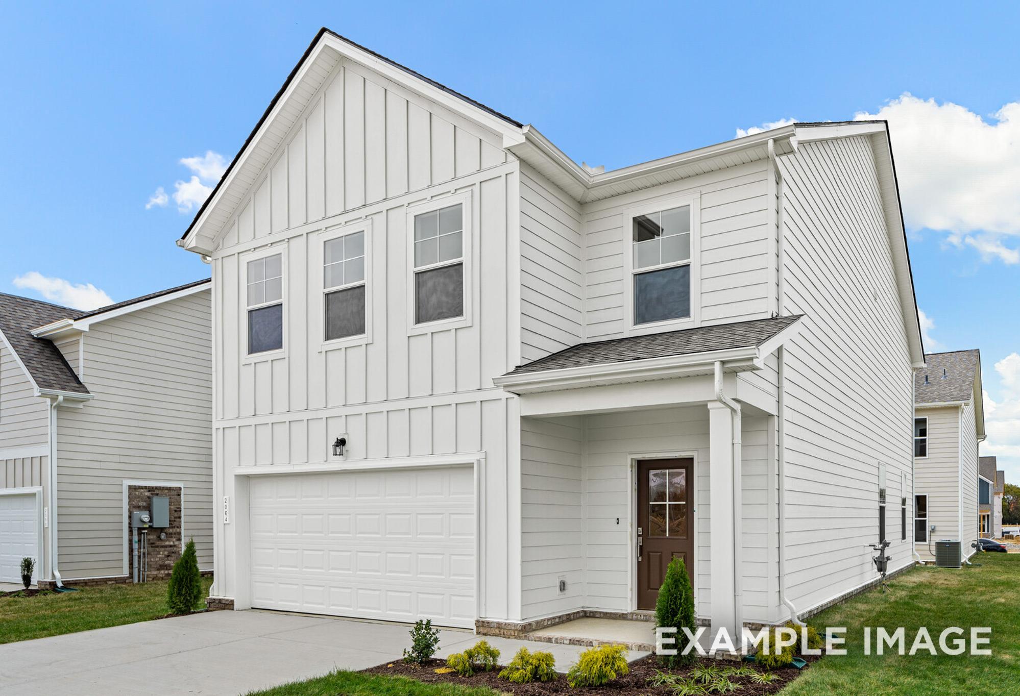 Two-story Grayson A elevation featuring white board-and-batten siding, covered front porch, and two-car garage