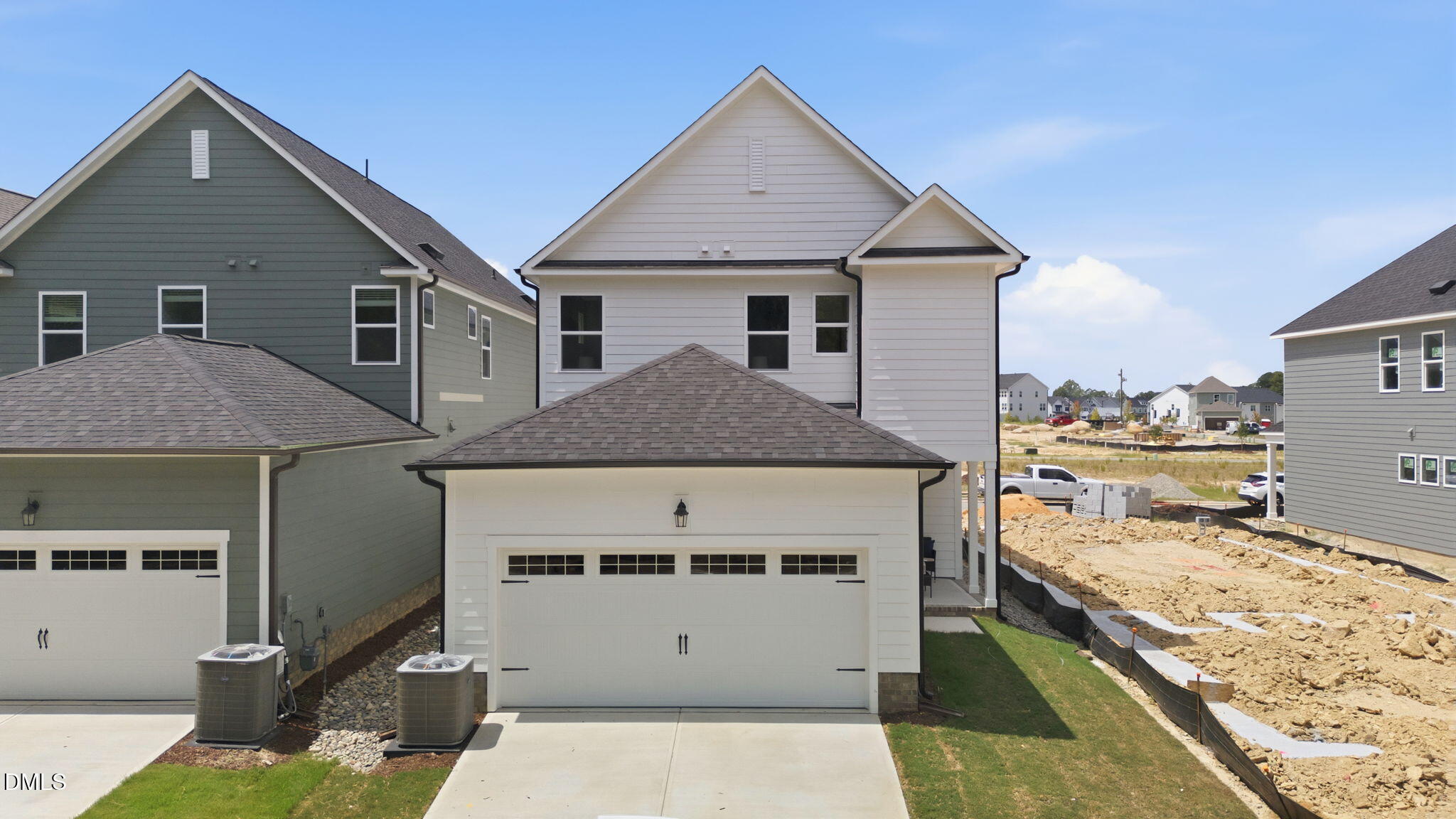 Two-story, 2-car garage exterior of The Harris C floor plan by Davidson Homes in Forestville Yard, Knightdale, NC.